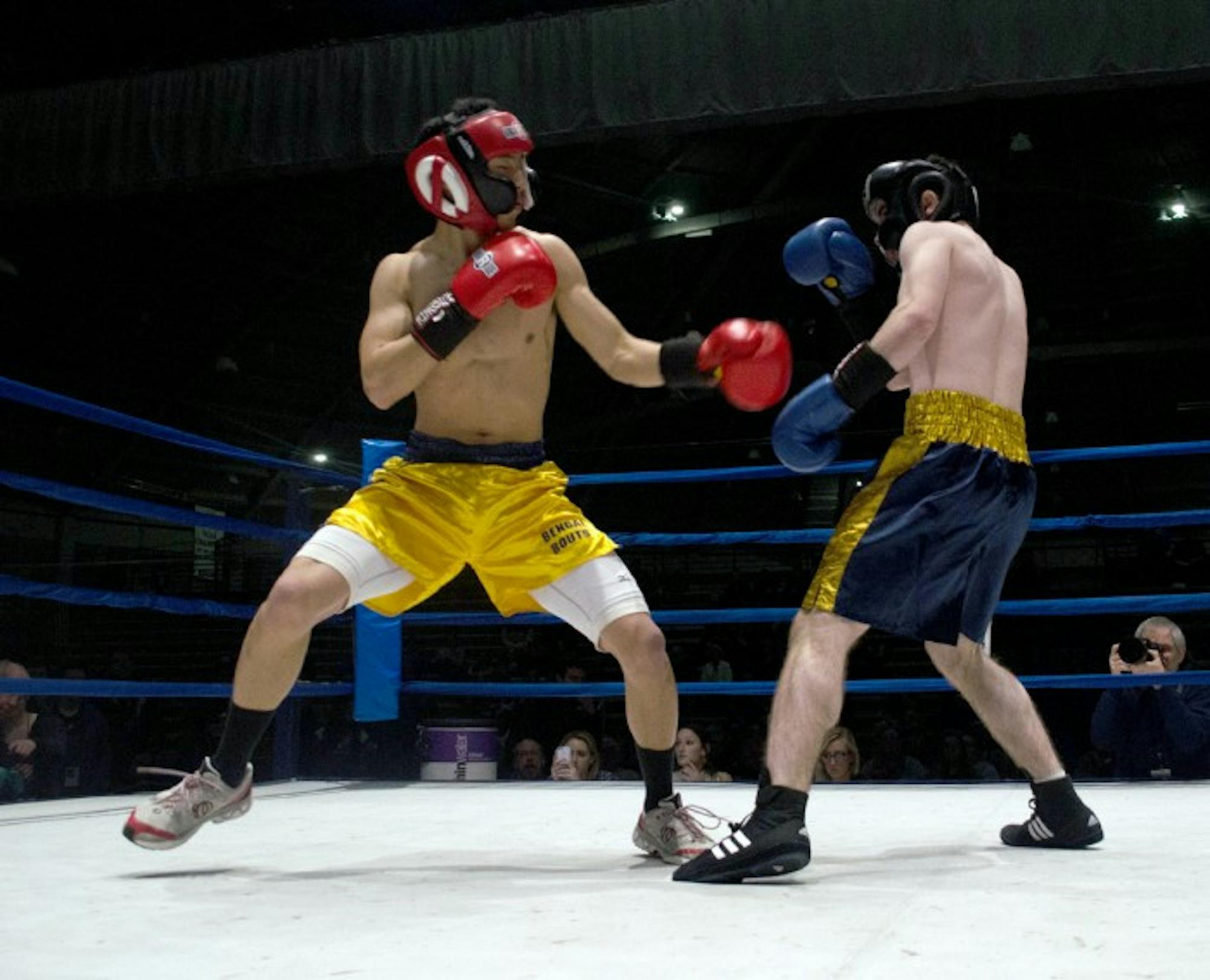 Andy Faustone (right) fights Jeffrey Wang in a round during last year’s Bengal Bouts. The Bouts  benefit Holy Cross missions in Bangladesh.