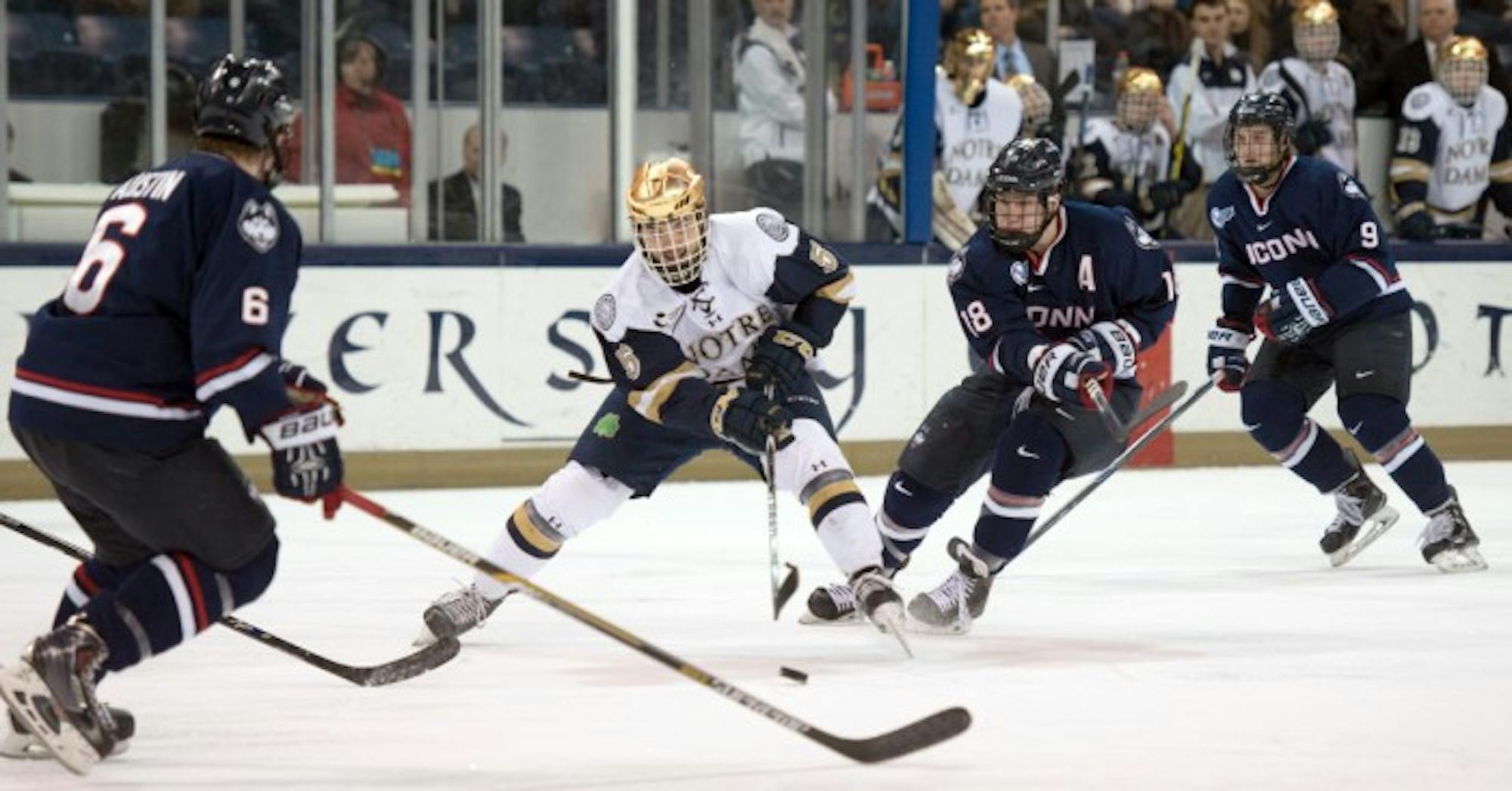 Irish senior defenseman Robbie Russo weaves through the UConn offensive zone during the two teams’ 3-3 tie Jan. 16 at Compton Family Ice Arena. Russo leads all Irish defensemen with 25 points this season.