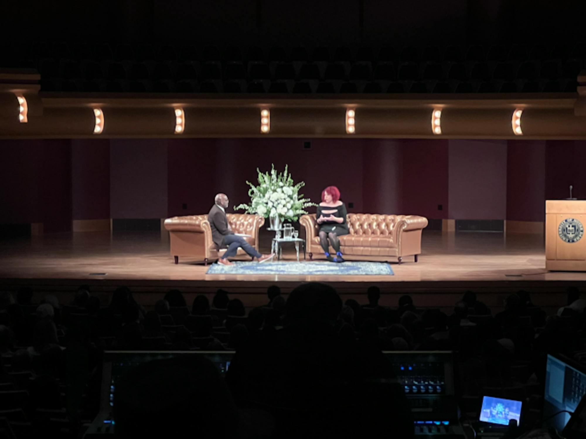Nikole Hannah-Jones discusses “The 1619 Project” with Professor Mark Sanders, stage with spotlight