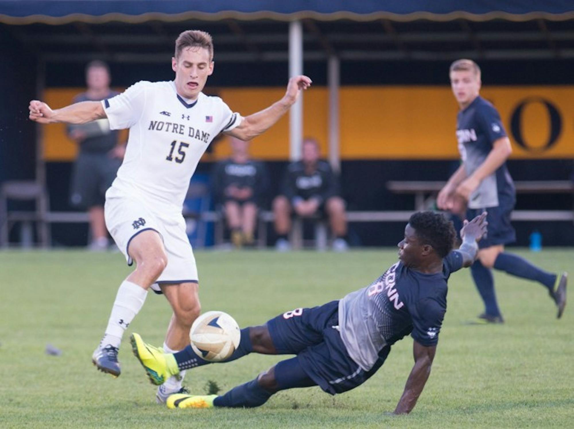 Irish graduate student midfielder Evan Panken battles for a loose ball during Notre Dame’s 1-0 double-overtime win over Connecticut on Tuesday. Panken has scored two game-winning goals this season for the Irish.