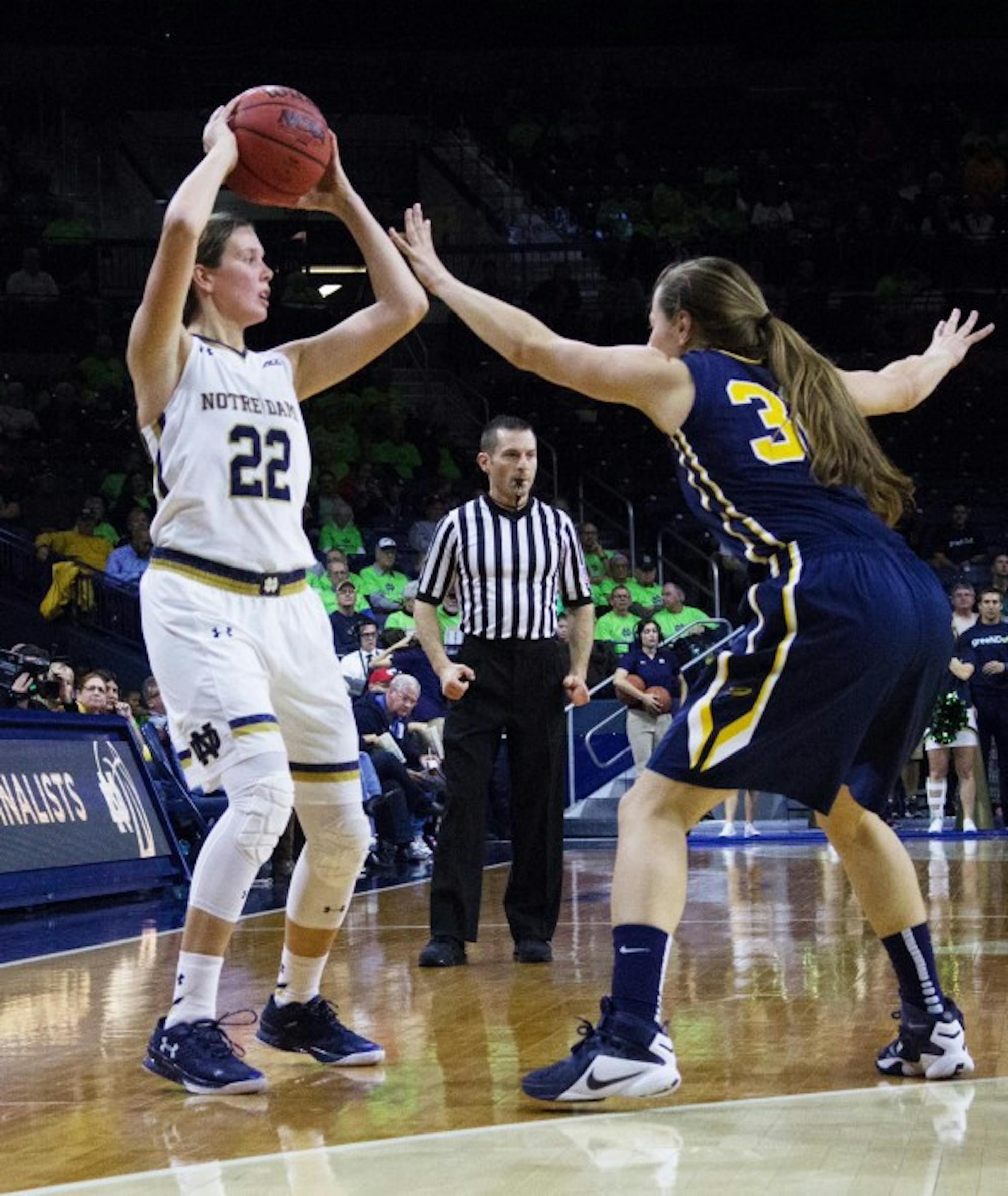Irish graduate student guard Madison Cable searches for a teammate during Notre Dame’s 74-39 win over Toledo on Nov. 18.