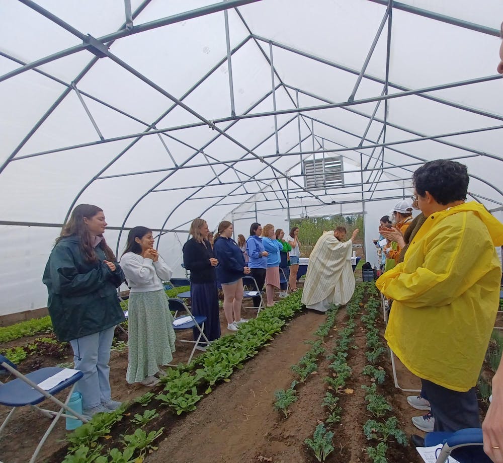Mass held inside the hoop house at the Sustainable Farm.jpg