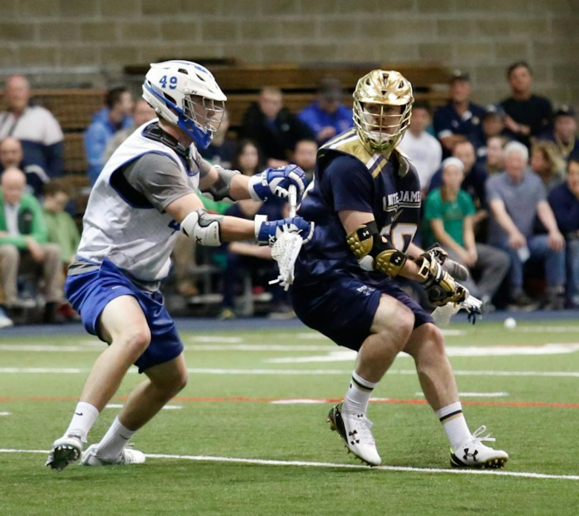 Irish senior attack Matt Kavanagh surveys his options during Notre Dame’s scrimmage against Air Force on Jan. 30 at Loftus Sports Center. Kavanagh led the Irish with 52 points and scored 27 goals last season.