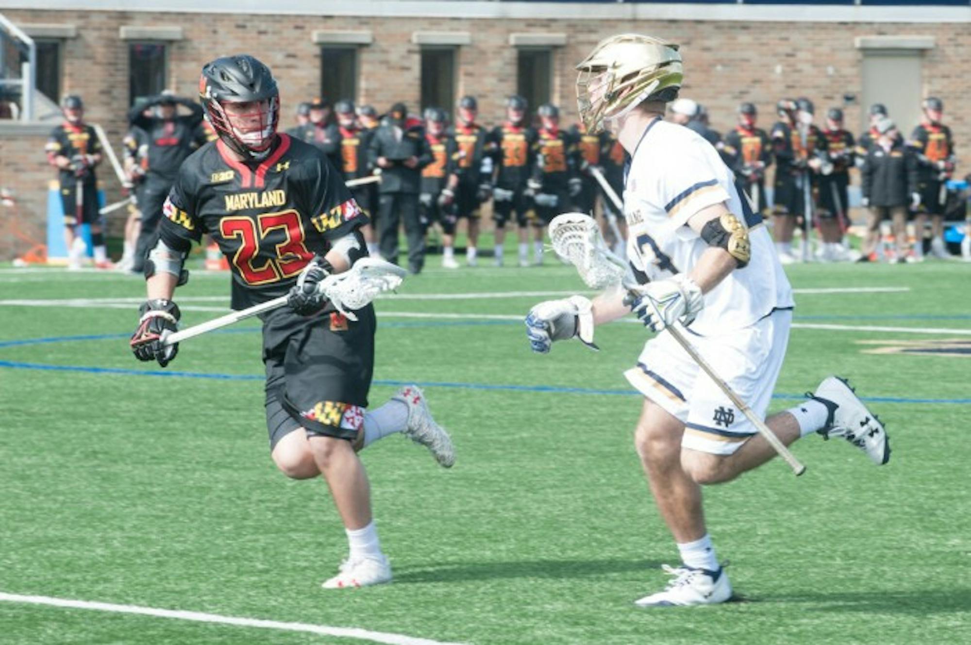 Irish senior midfielder Nick Koshansky looks to get by a defender during Notre Dame’s 5-4 victory over Maryland on Saturday at Arlotta Field. After the win, the Irish are now ranked No. 1 in the country.