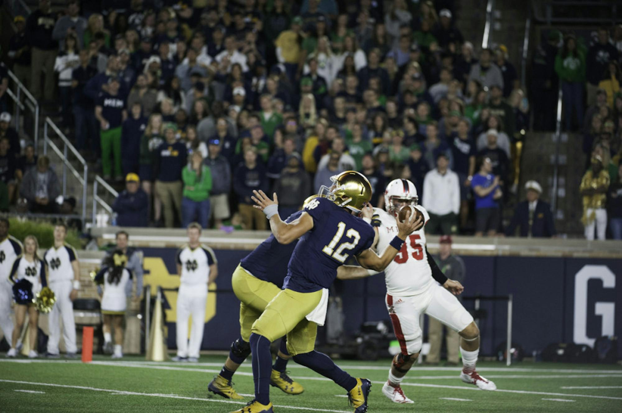 Irish sophomore quarterback Ian Book fires a pass during Notre Dame's 52-17 win over Miami (OH) on Saturday at Notre Dame Stadium.