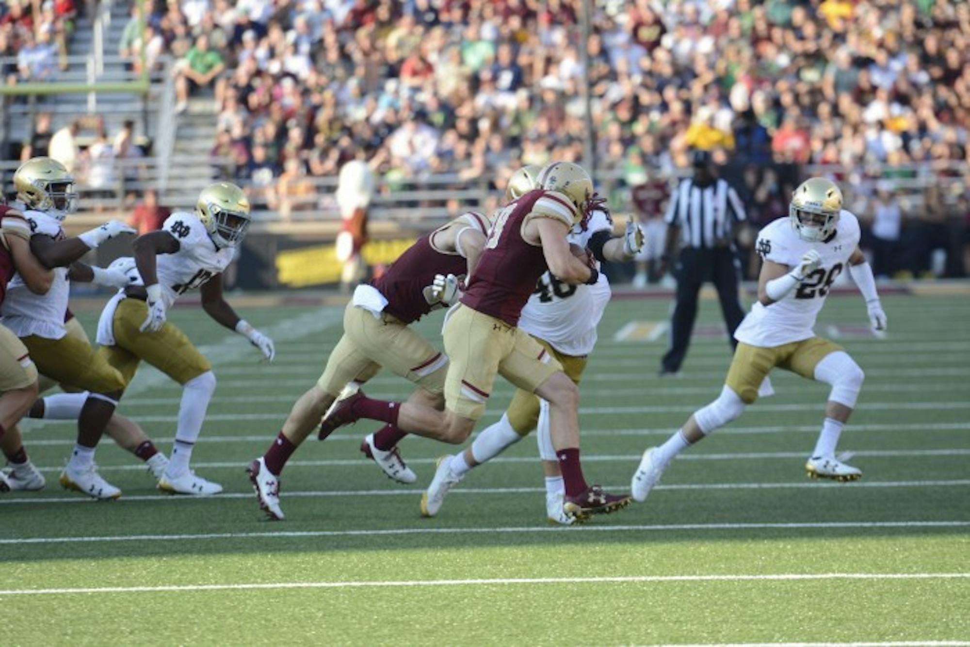 Irish senior captain Greer Martini pulls down a Boston College ball carrier in Notre Dame's 49-20 win over the Eagles on Saturday. Martini had 10 tackles in the game.