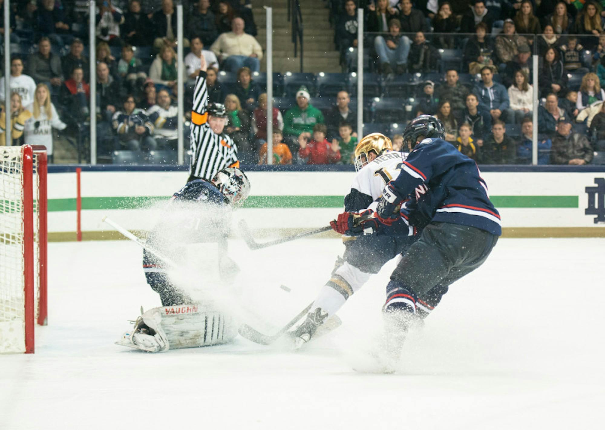 Irish junior left wing and alternate captain Sam Herr fires off a shot in a 3-3 tie at home with Connecticut on Jan. 16.