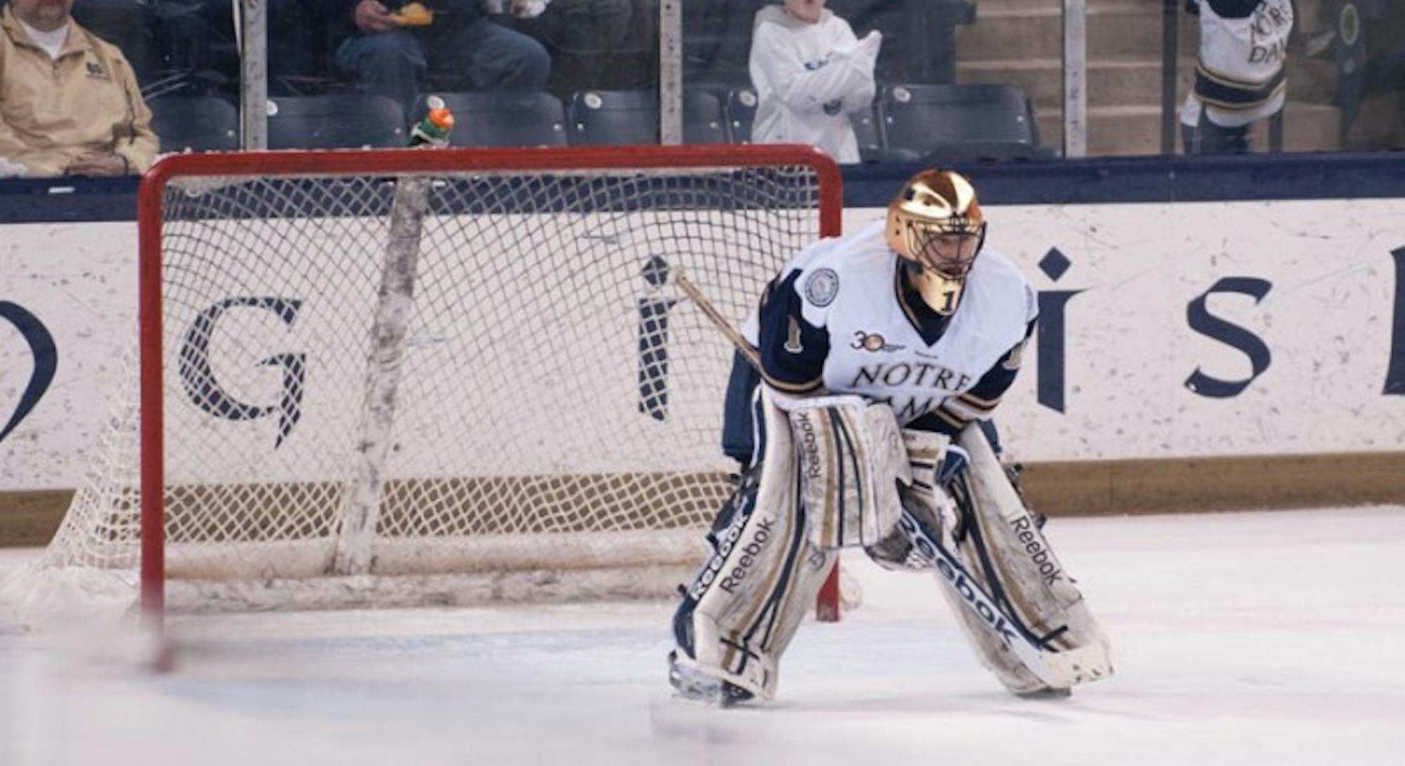 Irish senior goalkeeper Steven Summerhays crouches in net in Notre Dame’s 2-1 loss to Maine on Feb. 7. Summerhays stopped 83 of 85 shots he faced in two games over the weekend.