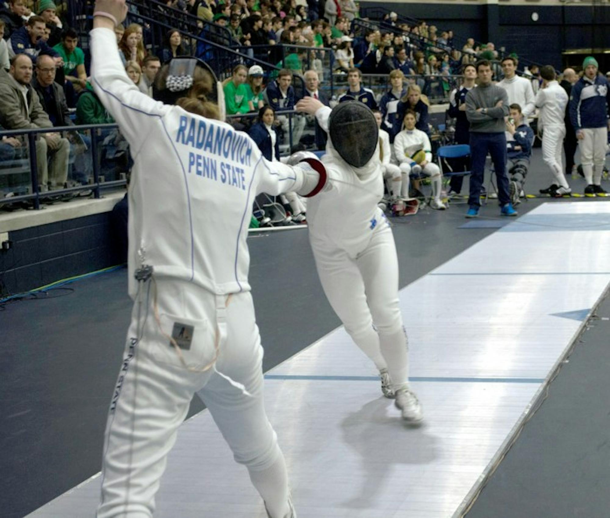Irish junior Catherine Lee, right, competes during the DiCicco Duals on Feb. 8 at Purcell Pavilion. Lee finished second in the epee.