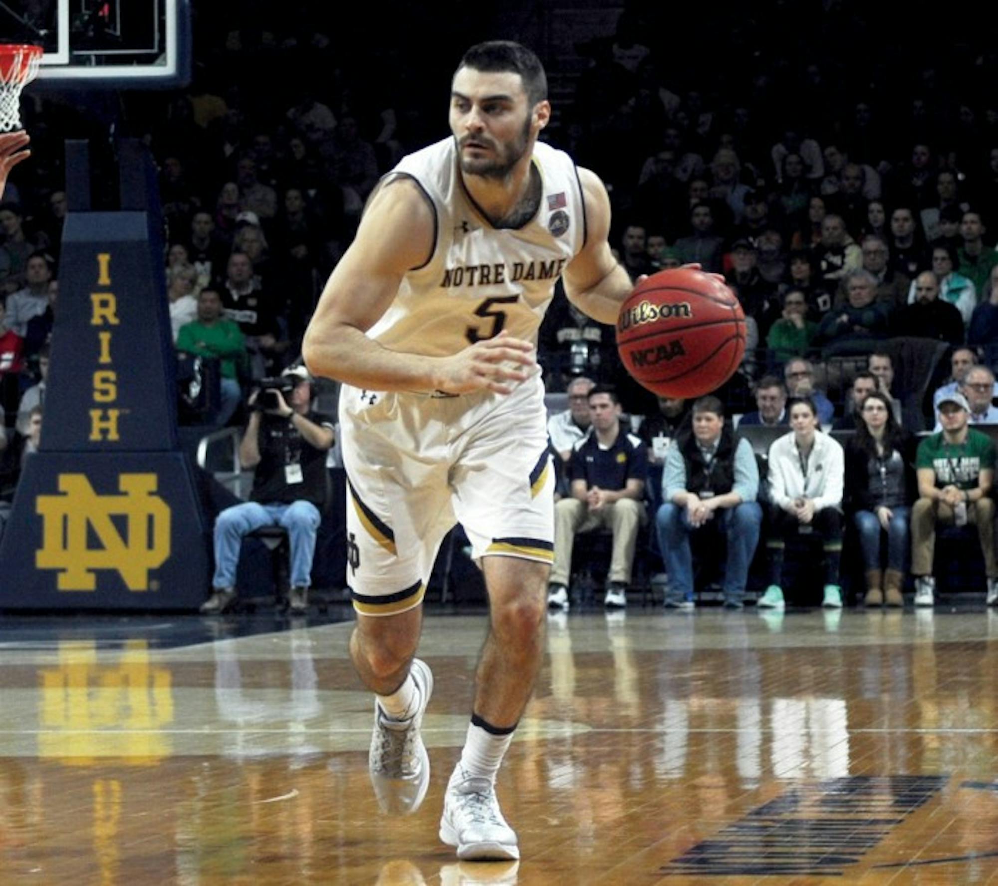 Irish junior guard Matt Farrell advances the ball up the court during Notre Dame’s 71-54 loss to Virginia on Tuesday at Purcell Pavilion. Farrell had 15 points and four assists in Notre Dame’s loss to Georgia Tech on Sunday.
