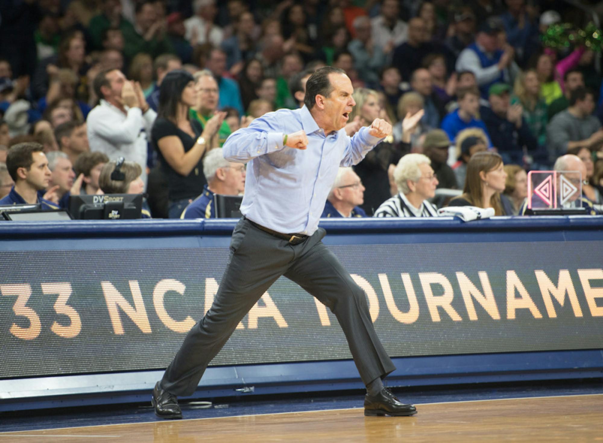 Irish coach Mike Brey cheers from the sidelines during Notre Dame’s come-from-behind win against Miami on Jan. 18.