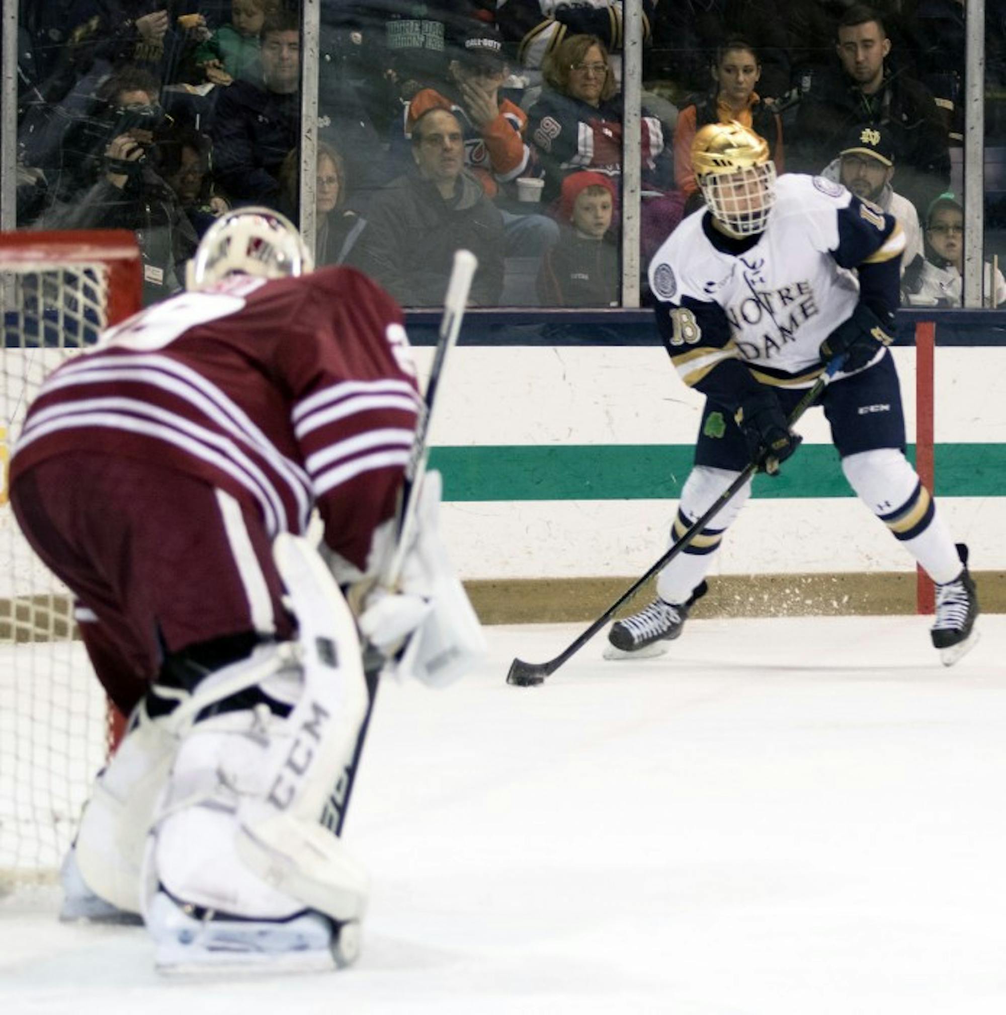 Sophomore center Jake Evans looks to pass the puck during Notre Dame’s 5-1 victory over UMass at Compton Family Ice Arena.