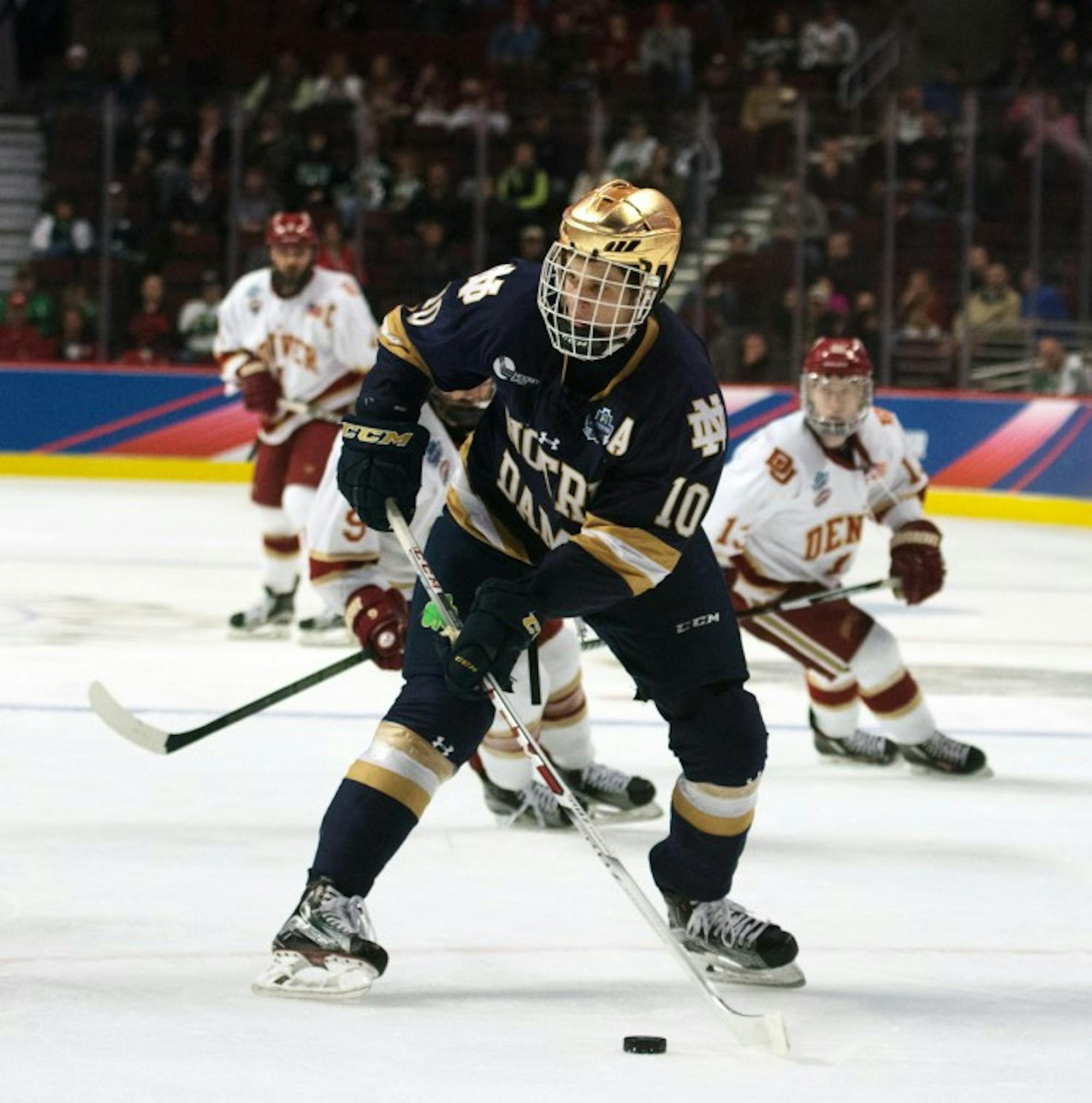 Irish junior forward Anders Bjork looks to pass the puck during Notre Dame’s 6-1 loss to Denver in the Frozen Four on April 6 at the United Center in Chicago. Bjork took one shot in the game.