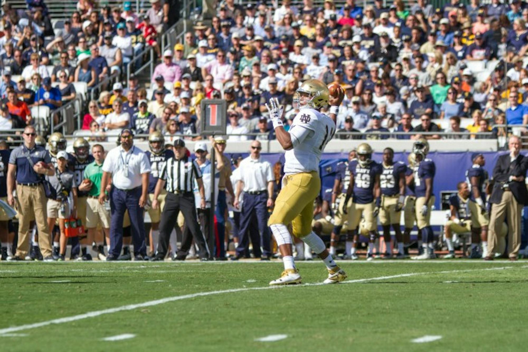 DeShone Kizer winds up to throw a pass toward the sideline.