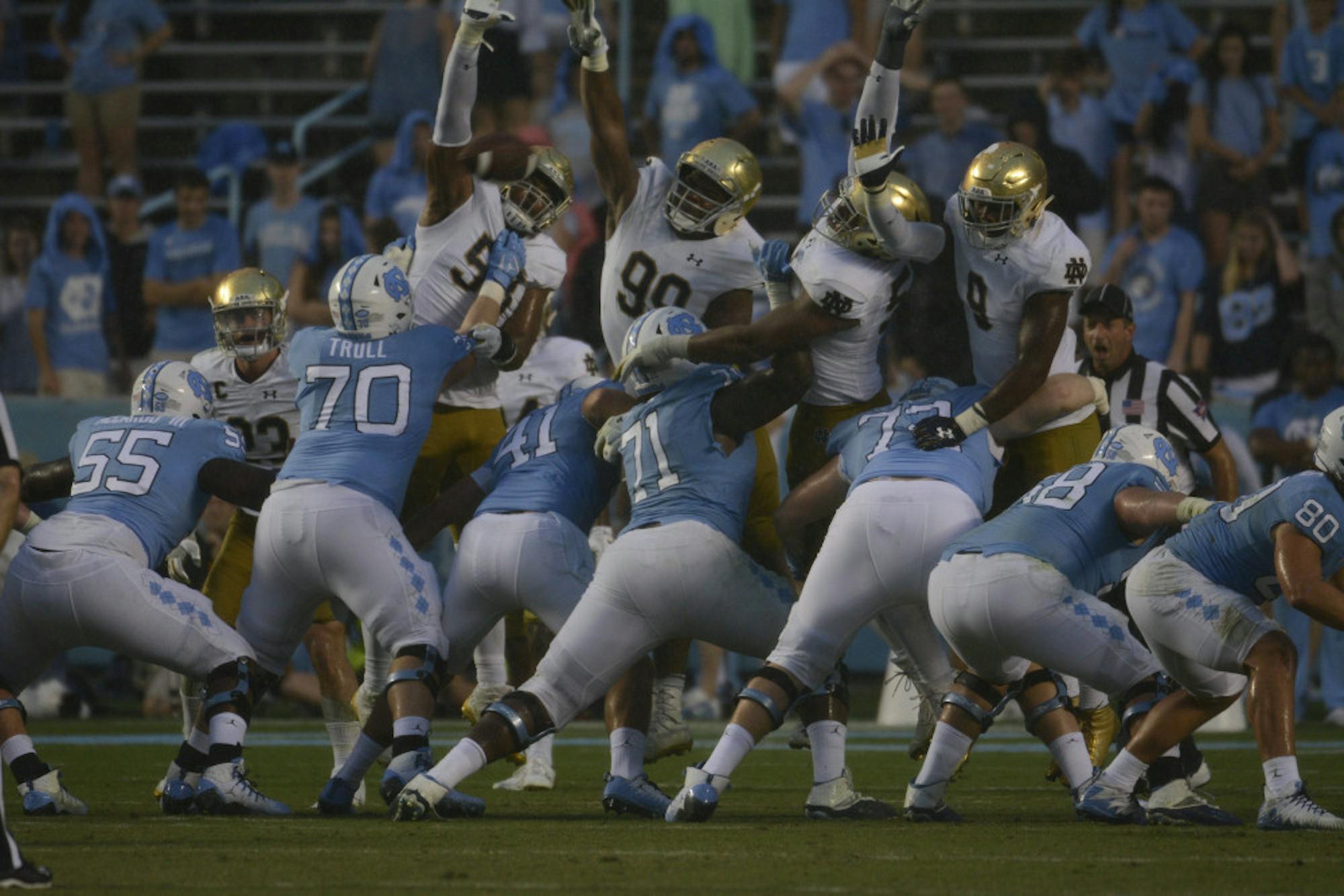 Irish junior defensive lineman Jerry Tillery, middle, and the Irish defensive line attempt to block an extra-point attempt during Notre Dame's 33-10 win over North Carolina on Saturday at Kenan Memorial Stadium in Chapel Hill, North Carolina.