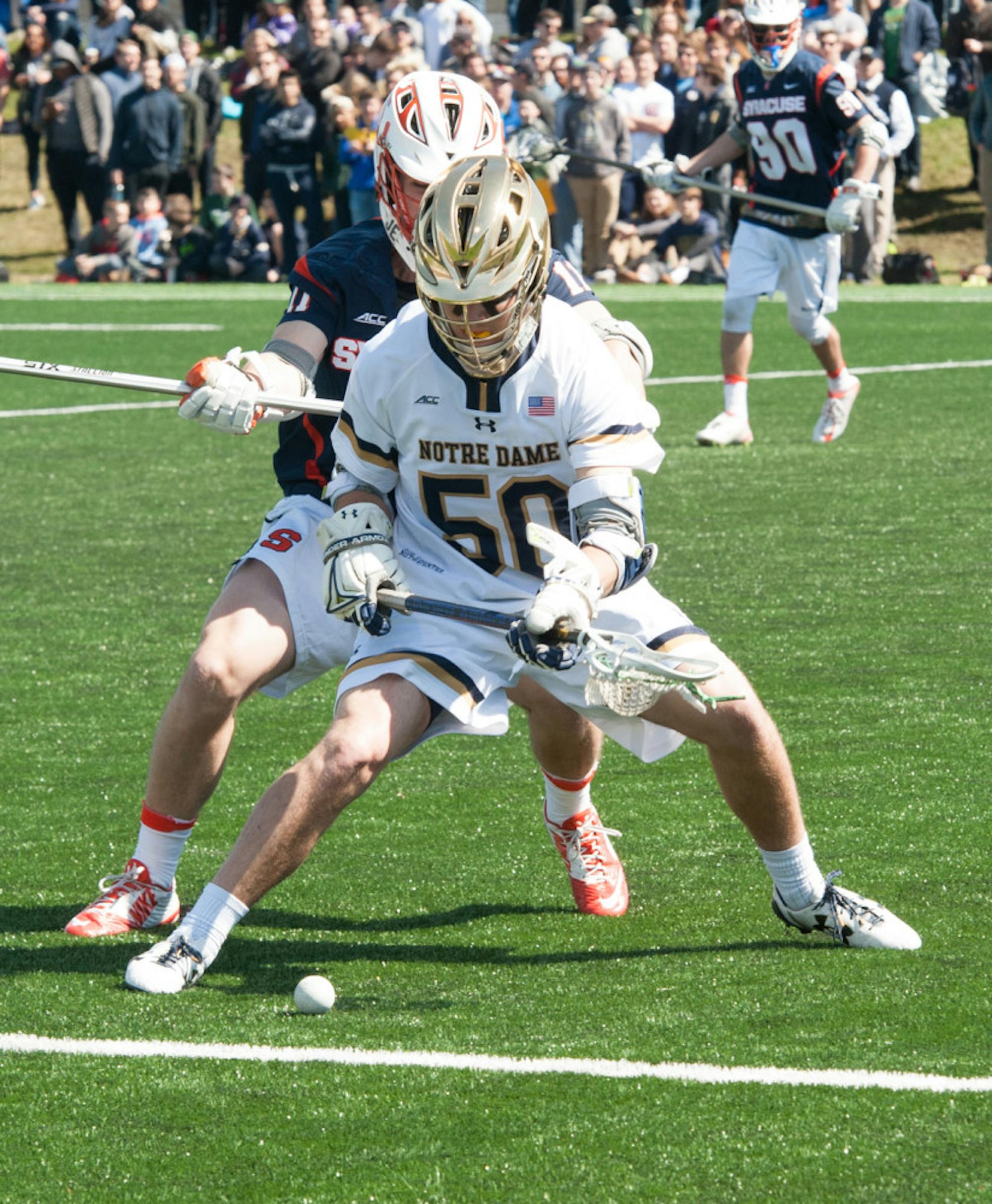 Irish sophomore attack Ryder Garnsey fights for a ground ball during Notre Dame’s 11-10 loss to Syracuse on April 1.