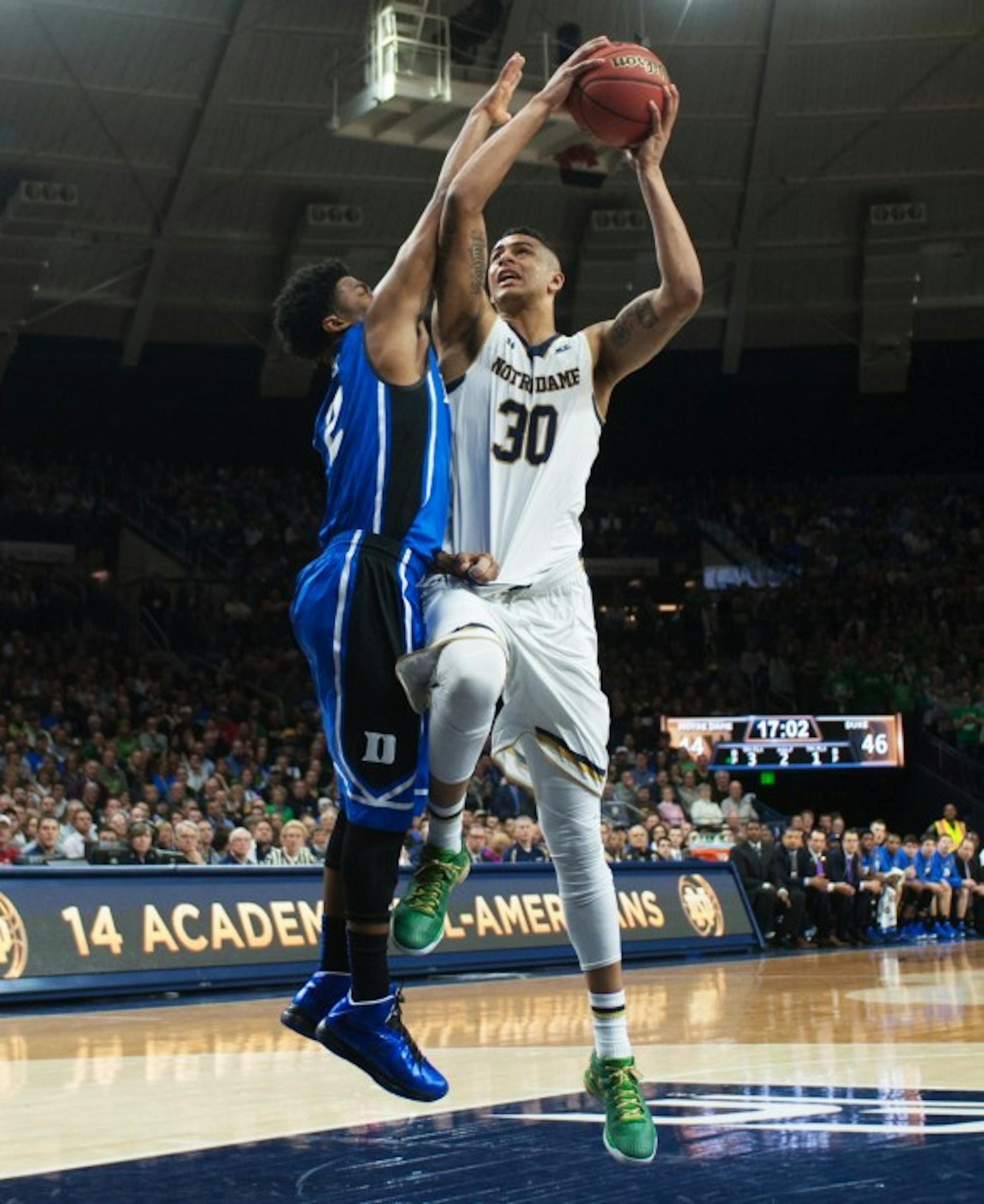 Senior forward Zach Auguste drives the lane during the Irish victory over Duke on Jan. 28 at Purcell  Pavilion. The new season begins next week after a final exhibition tilt against Caldwell on Thursday.