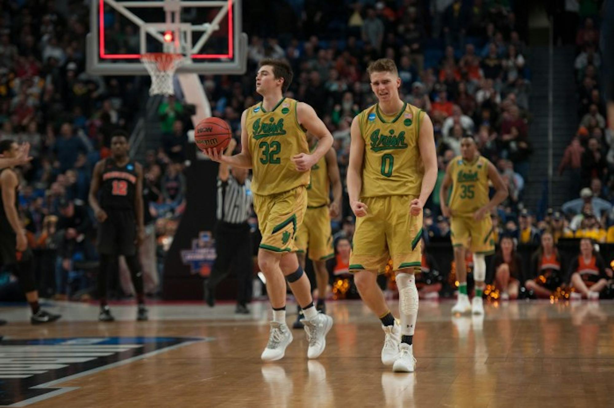 Irish sophomore guard Rex Pflueger celebrates after Notre Dame's 60-58 victory over Princeton on Thursday at KeyBank Arena. Pflueger had four points in the contest, after requiring stitches after taking an elbow to the head.