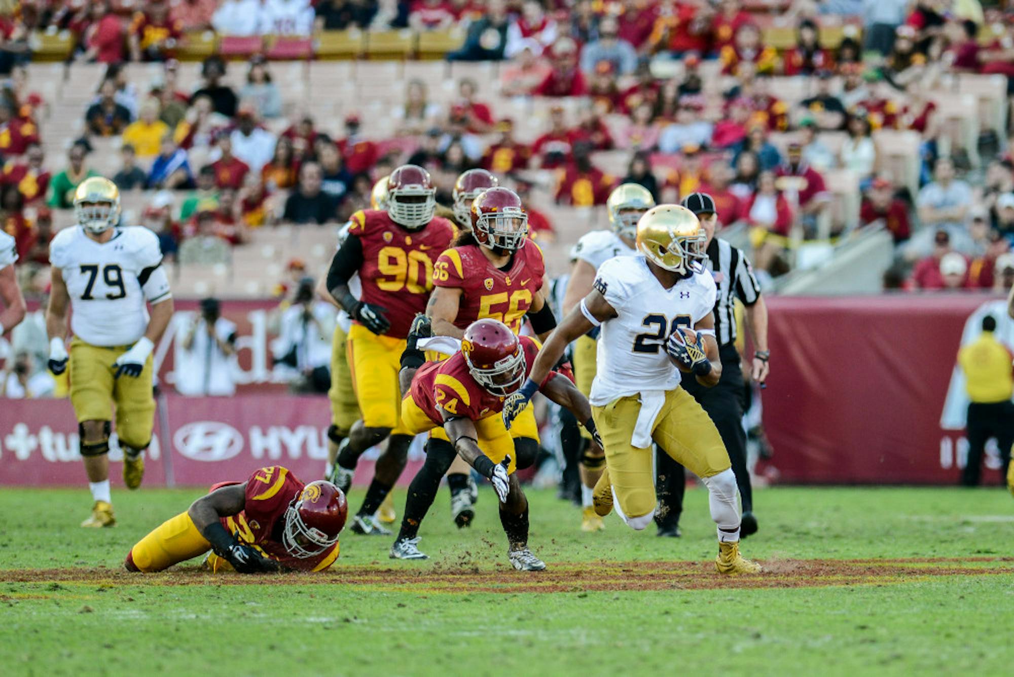 Irish junior running back C.J. Prosise attempts to outrun USC defenders.