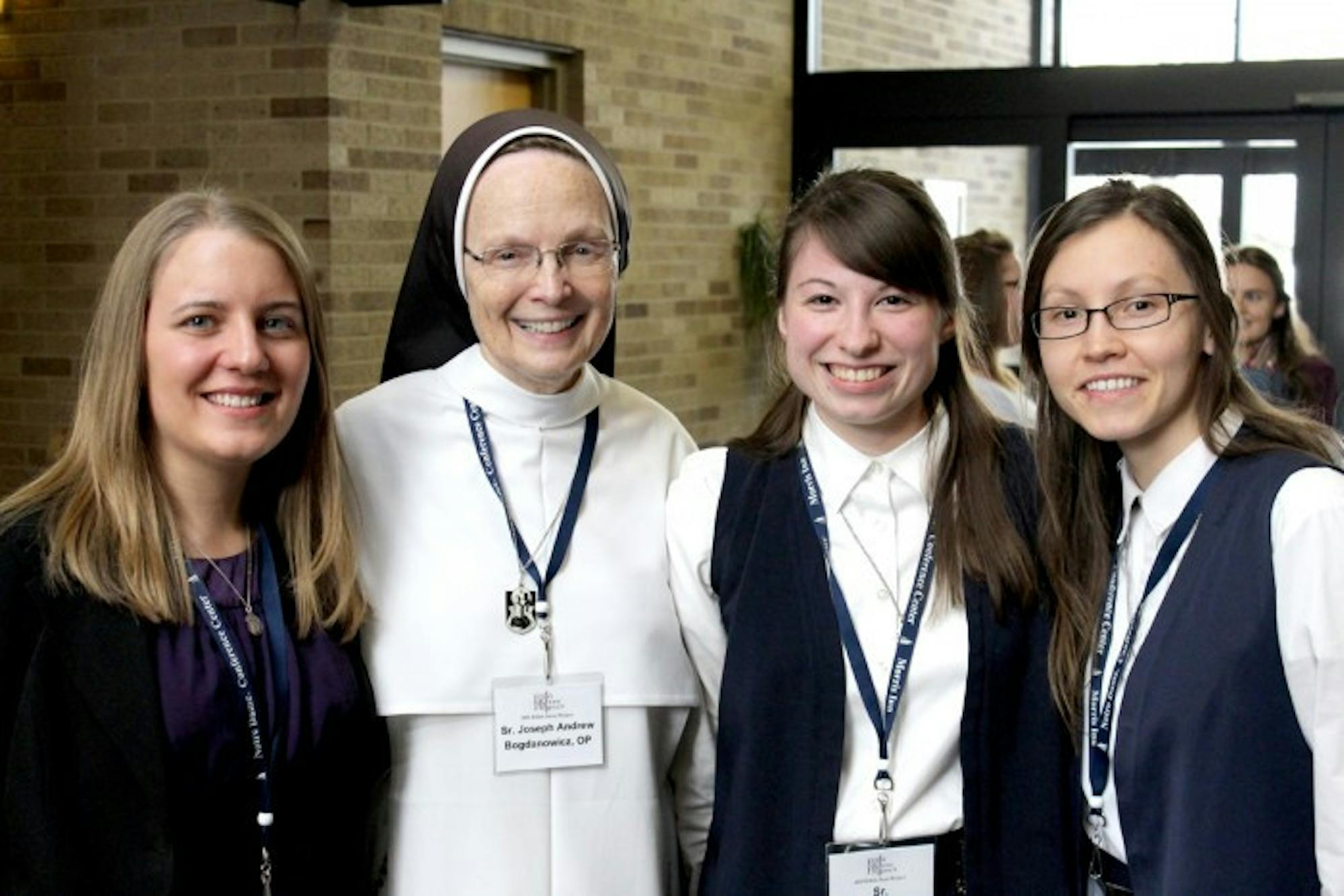 Senior Christina Serena (left) will join the Dominican Sisters of Mary, Mother of the Eucharist in August. To her left are Sister Joseph Andrew, foundress and vocations director of the order, and two postulants.
