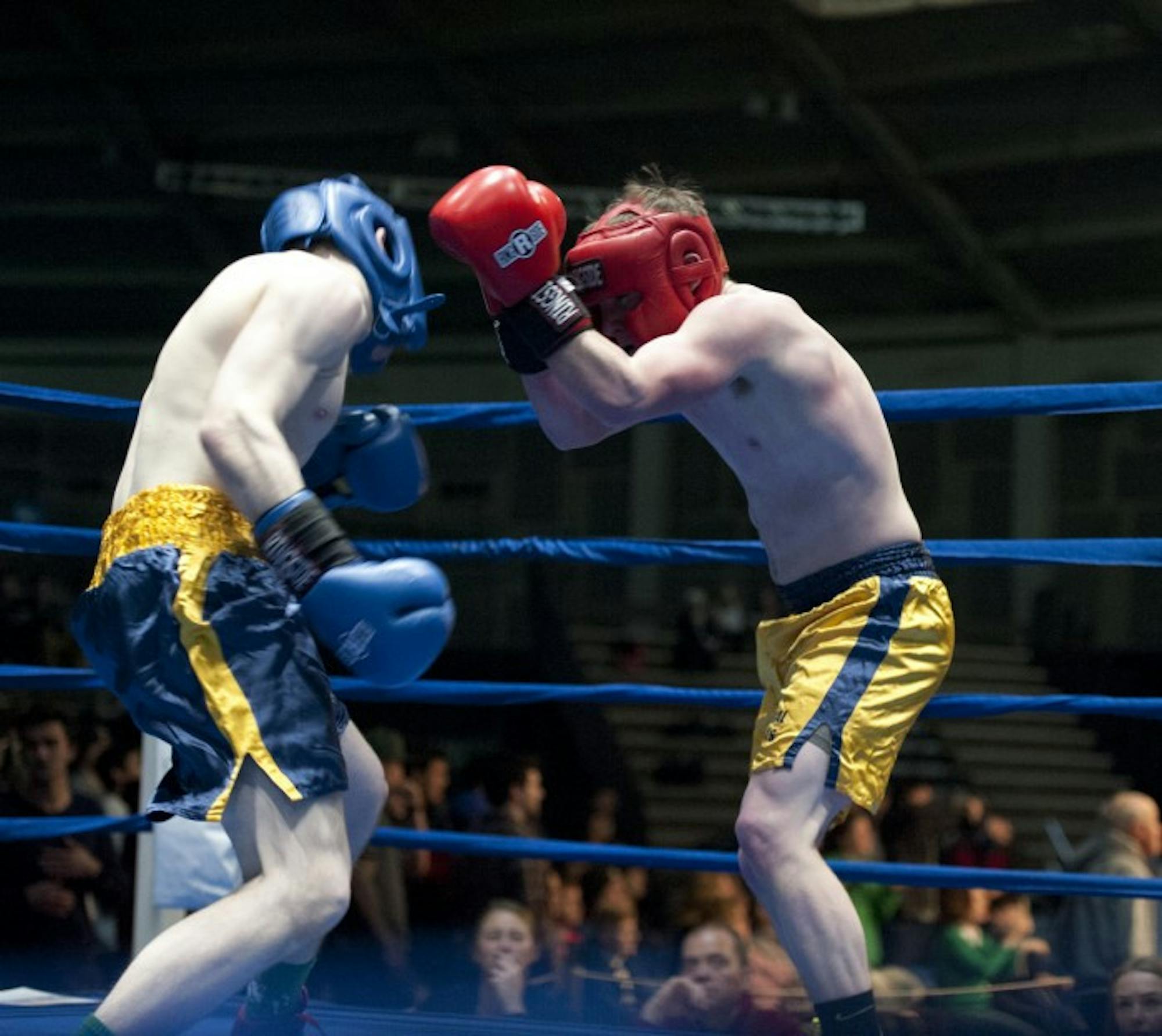 Adam Pasquinelly, right, clinches Ryan Dunn at Sunday night's preliminary bouts.