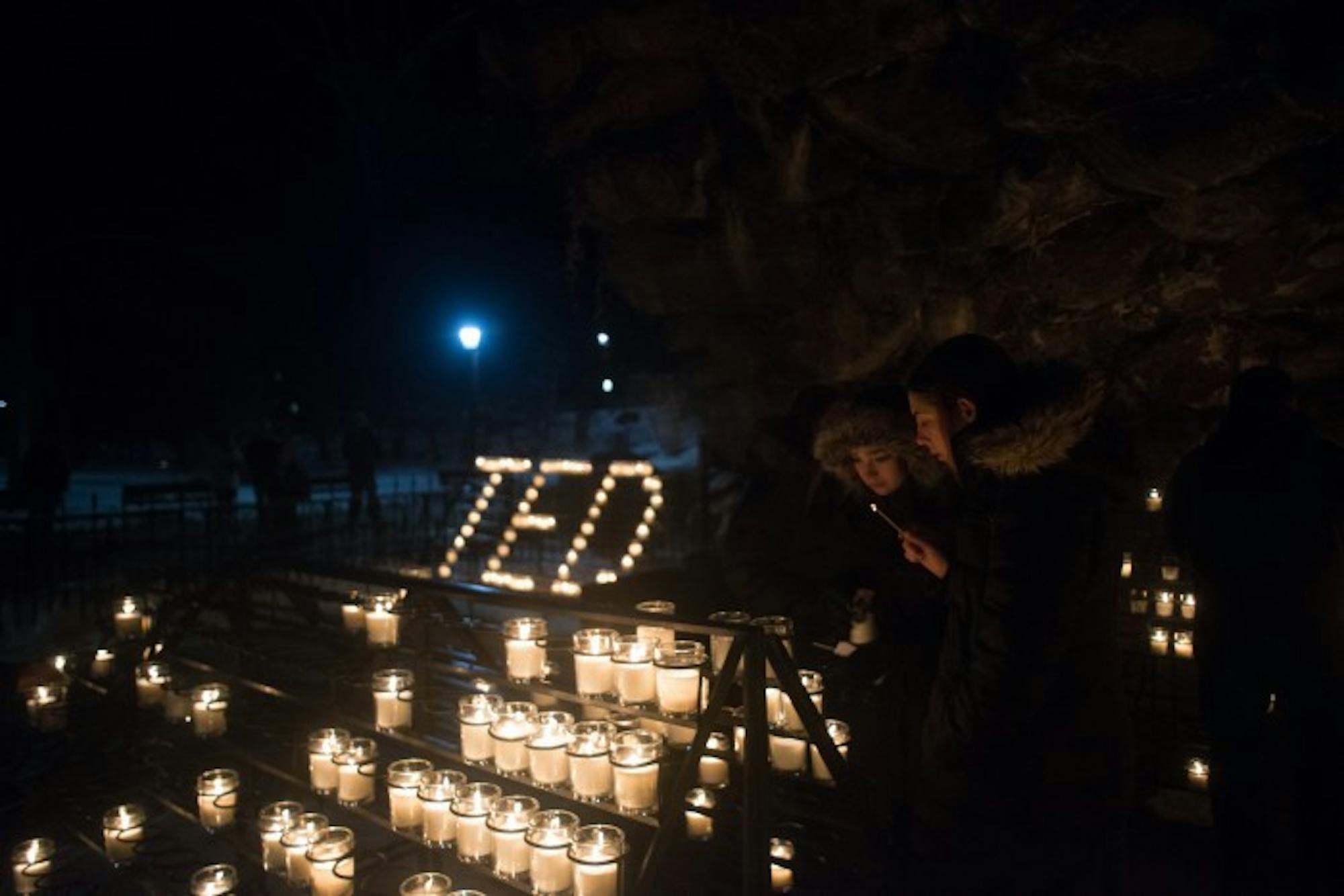 Candles illuminate The Grotto in memory of Fr. Theodore Hesburgh, who died Thursday at 97.