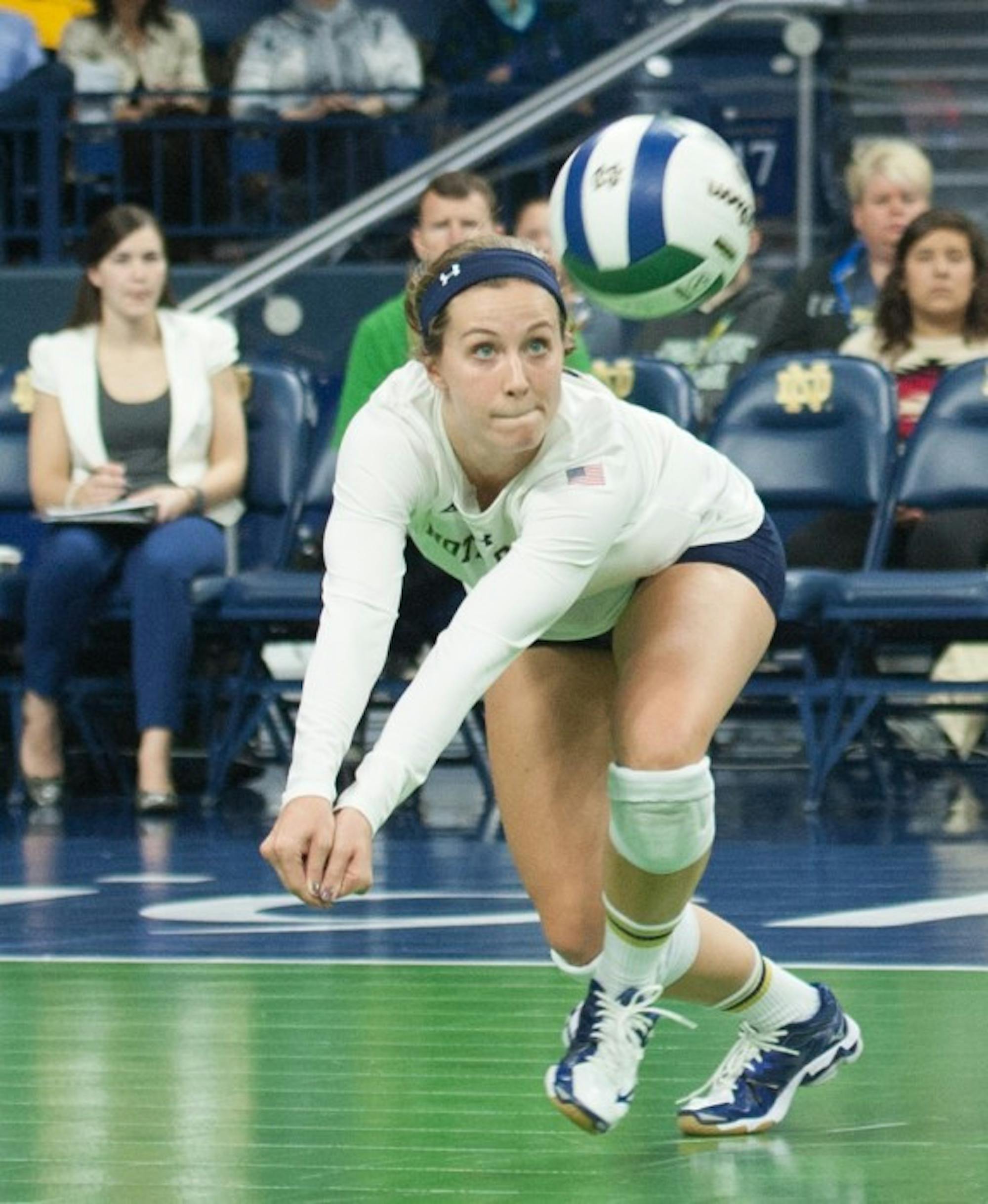 Irish senior libero Kathleen Severyn dives for a shot during Notre Dame’s 3-2 win over Louisville on Nov. 9 at Purcell Pavilion.