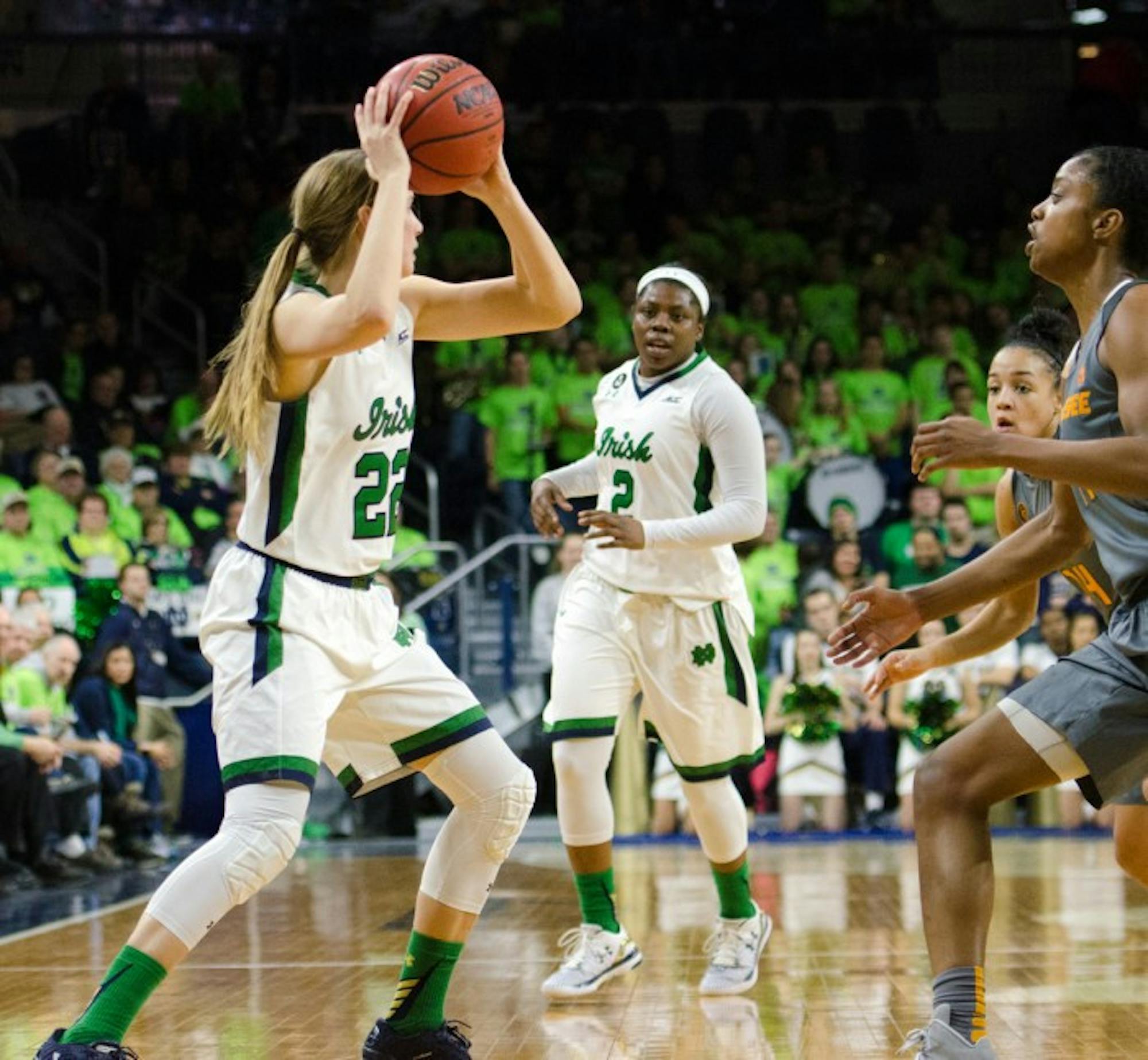 Graduate student guard Madison Cable, left, searches for a  teammate during Notre Dame’s 79-66 win over Tennessee on Jan. 18.