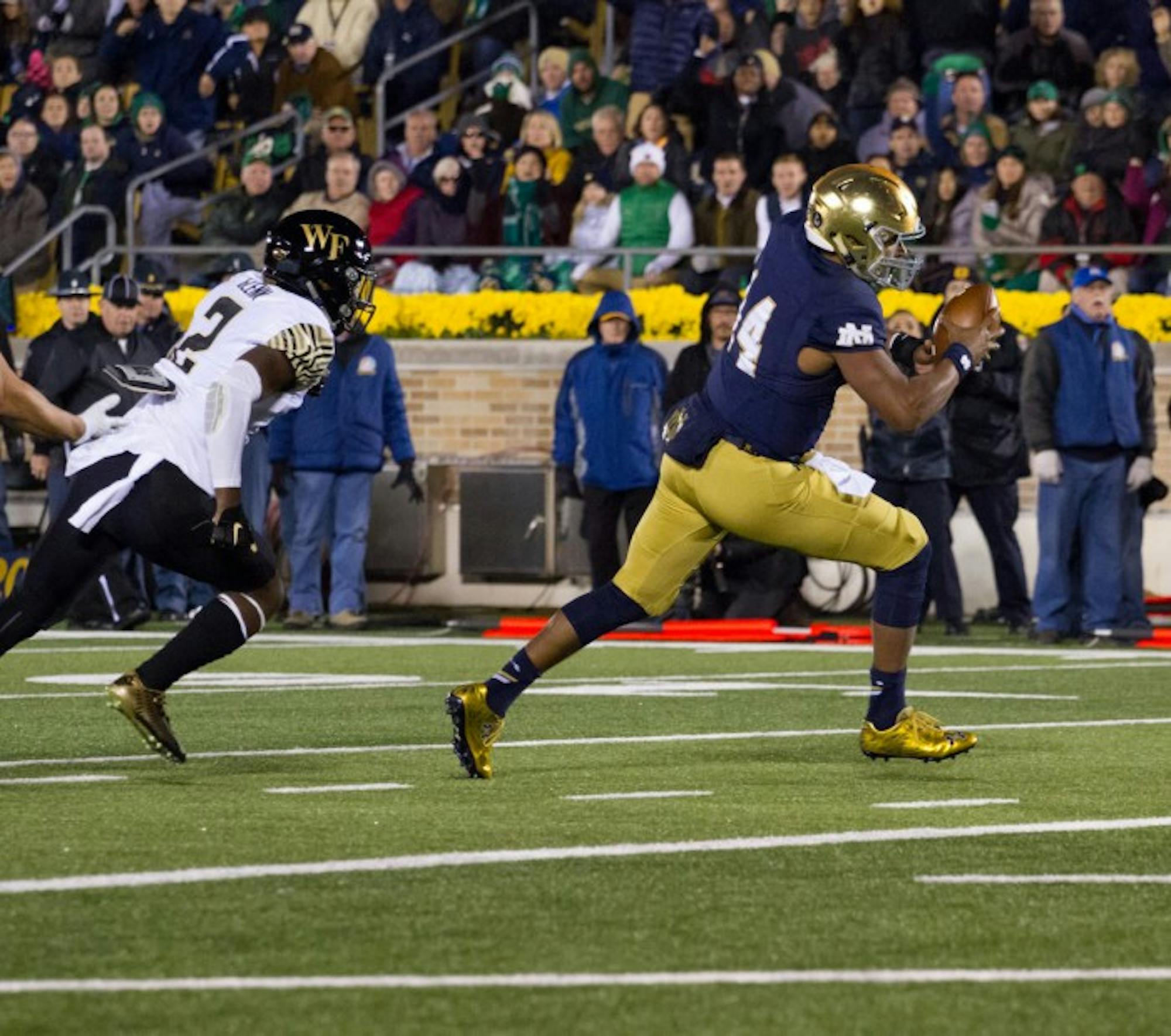 Irish sophomore quarterback DeShone Kizer carries the ball into the end zone to restore Notre Dame’s three-score advantage in the fourth quaurter of Saturday’s 28-7 win over Wake Forest.