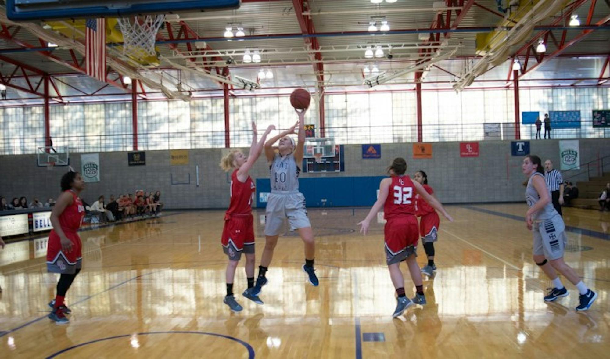 Belles senior forward Eleni Shea takes a shot during Saint Mary’s 52-49 loss to Olivet on Saturday at Angela Athletic Facility.  Shea, one of the team’s captains this season, scored eight points, grabbed seven rebounds and dished out two assists during the game.