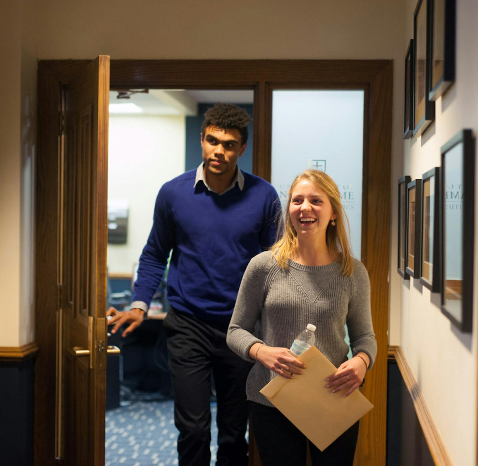 Corey Robinson and Becca Blais emerge from the Judicial Council office after receiving news they had won the student body election for president and vice president.