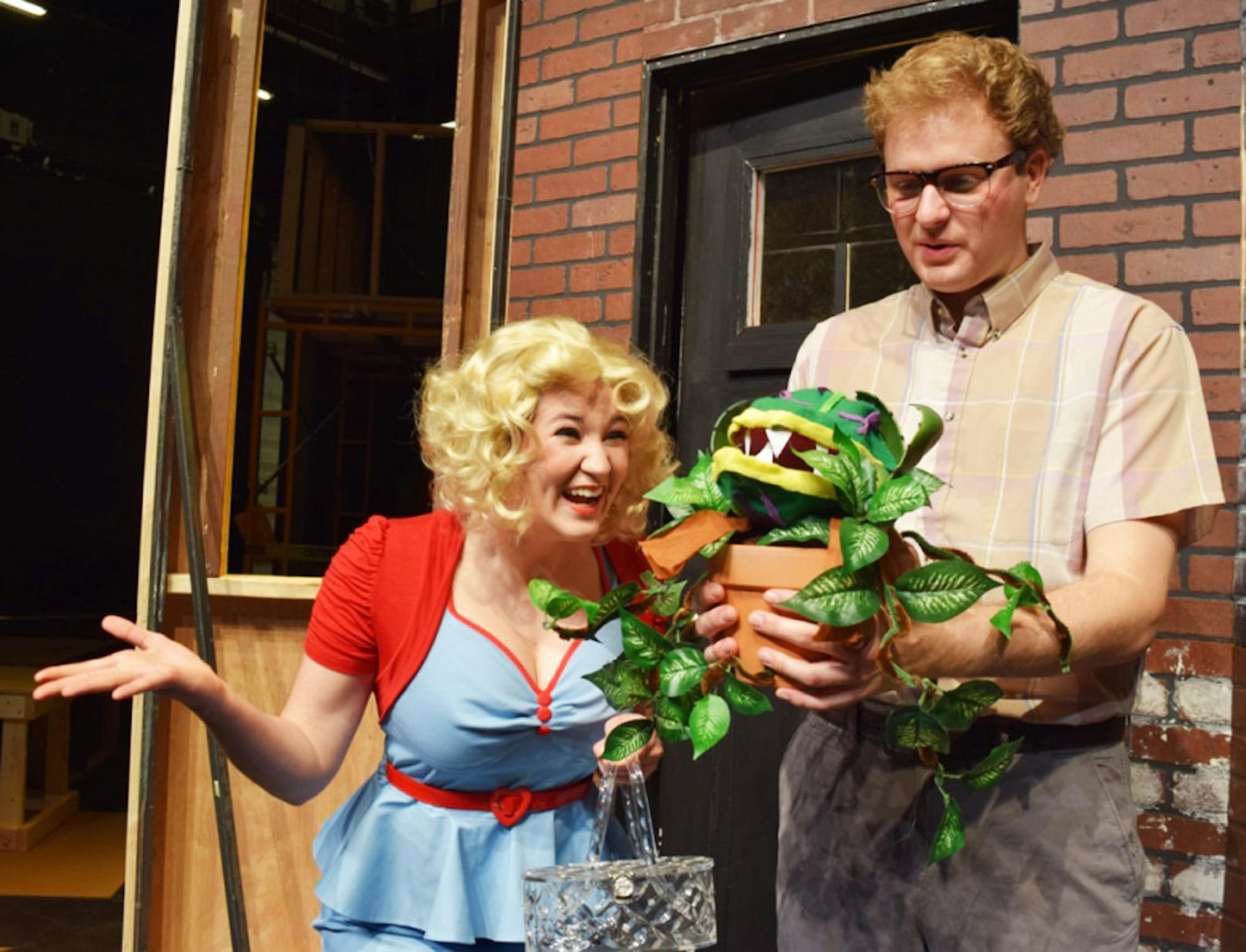 Juniors Maggie Moran (left) and Quint Mediate prepare for their upcoming performance of “The Little Shop of Horrors.”