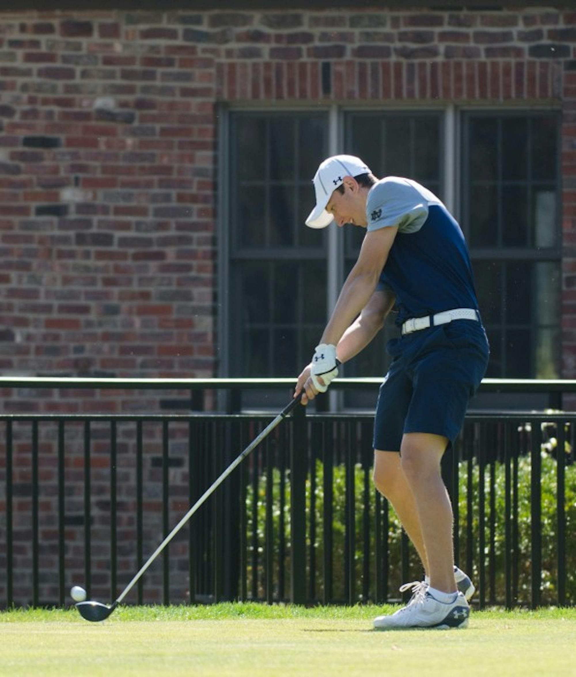 Irish sophomore Thomas Steve tees off at the Battle at the Warren on April 16. The Irish won the home tournament by 33 strokes.