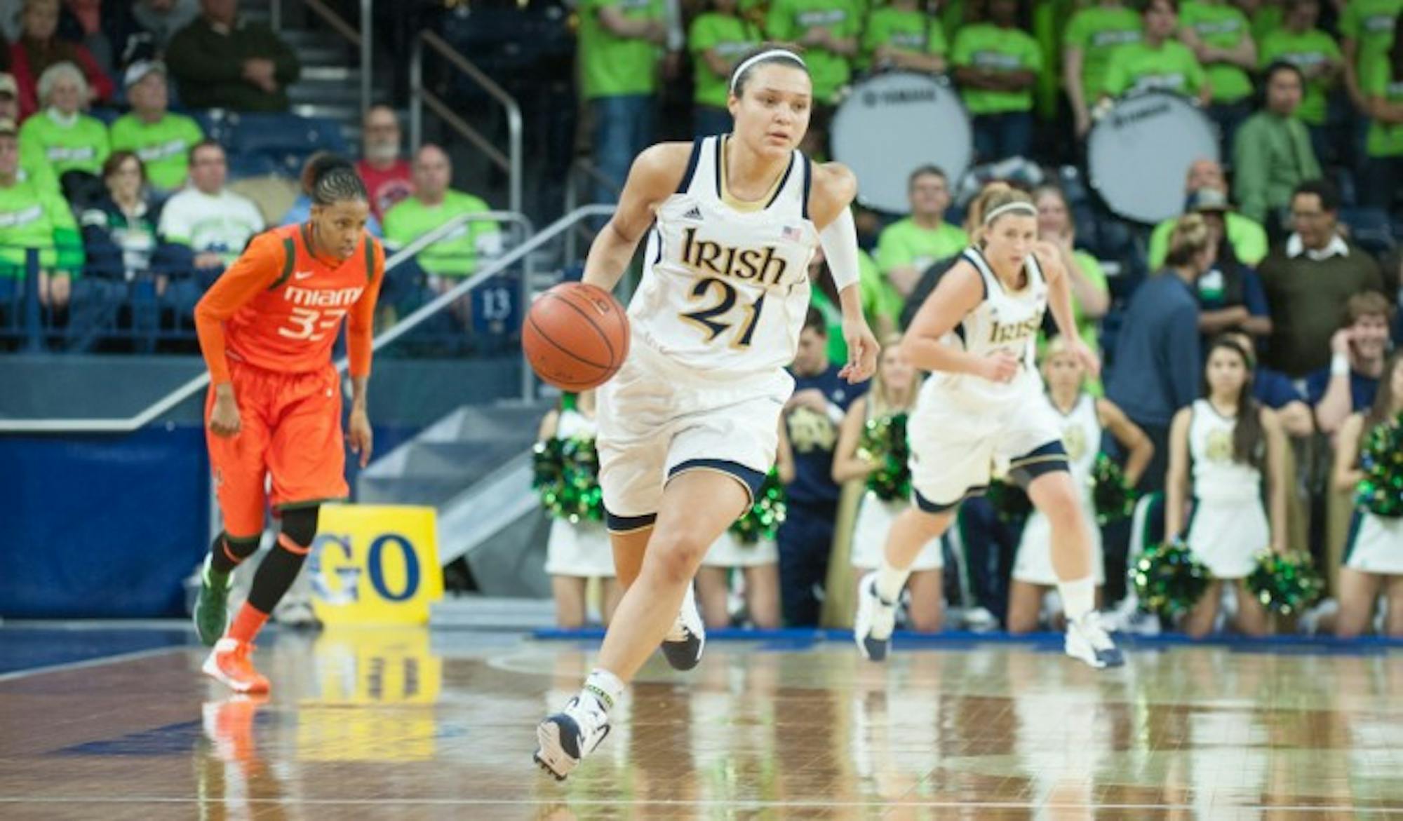 Former Irish guard Kayla McBride dribbles the ball up the court during Notre Dame’s 72-59 win over  Miami on Jan. 23, 2014 at Purcell Pavilion. McBride currently plays for the San Antonio Stars.