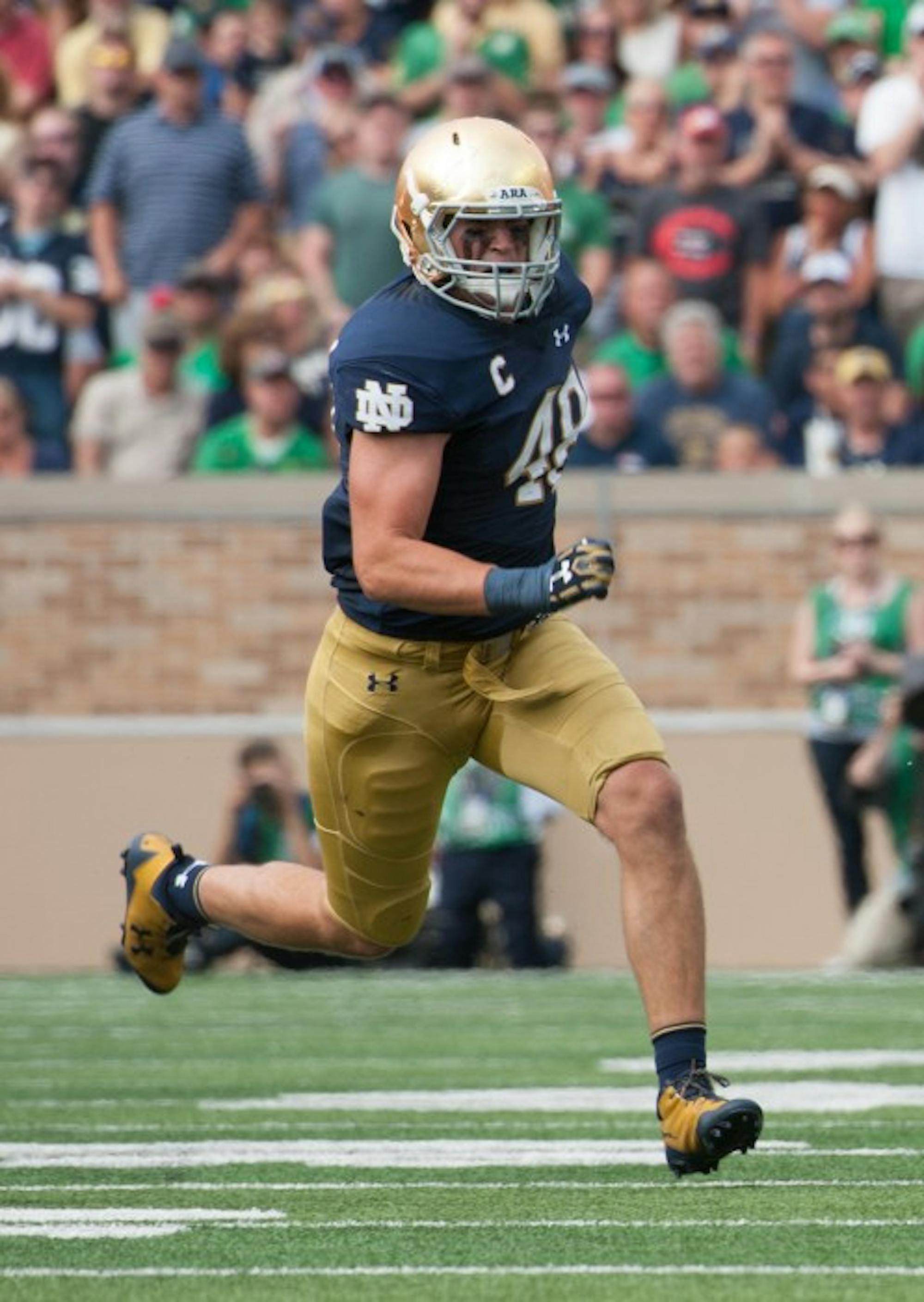 Irish senior linebacker Greer Martini runs towards the play during Notre Dame's 49-16 victory over Temple on Sept. 2 at Notre Dame Stadium. Martini recorded six tackles and a forced fumble in the contest.