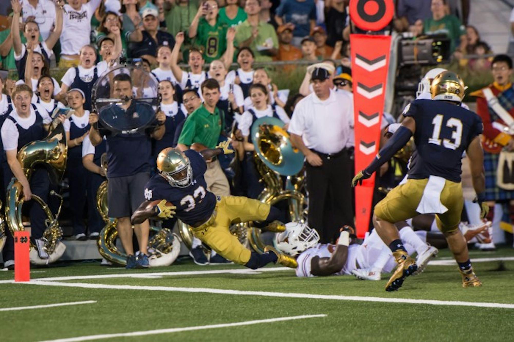 Irish freshman running back Josh Adams dives for the goal line during Notre Dame's 38-3 win over Texas on Saturday.