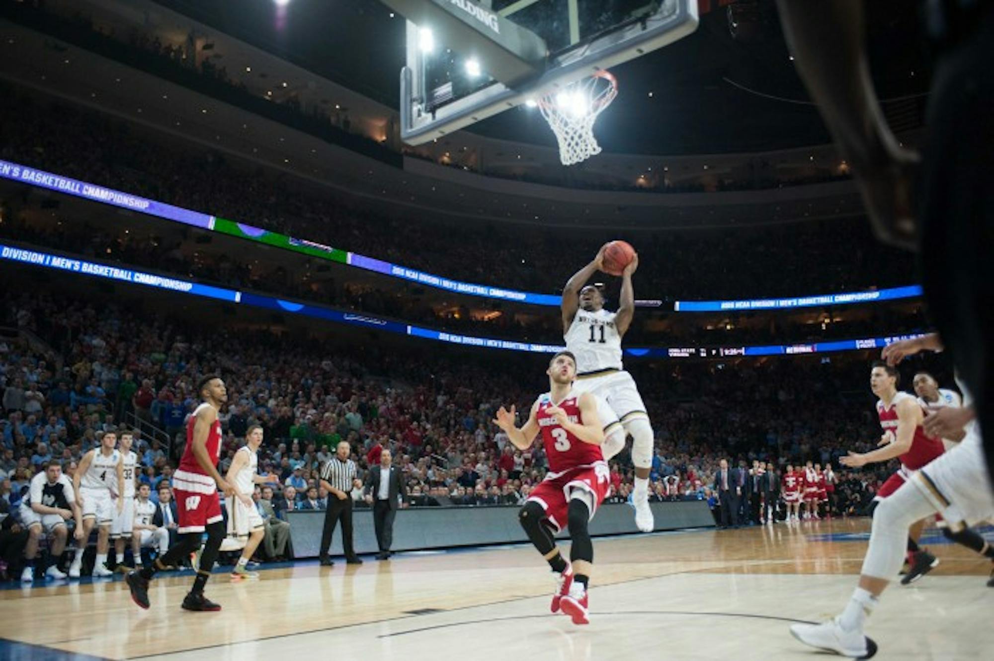Irish junior guard Demetrius Jackson lays in the game-winning shot with 14 seconds left in Notre Dame’s 61-56 win over Wisconsin on Friday in Philadelphia.