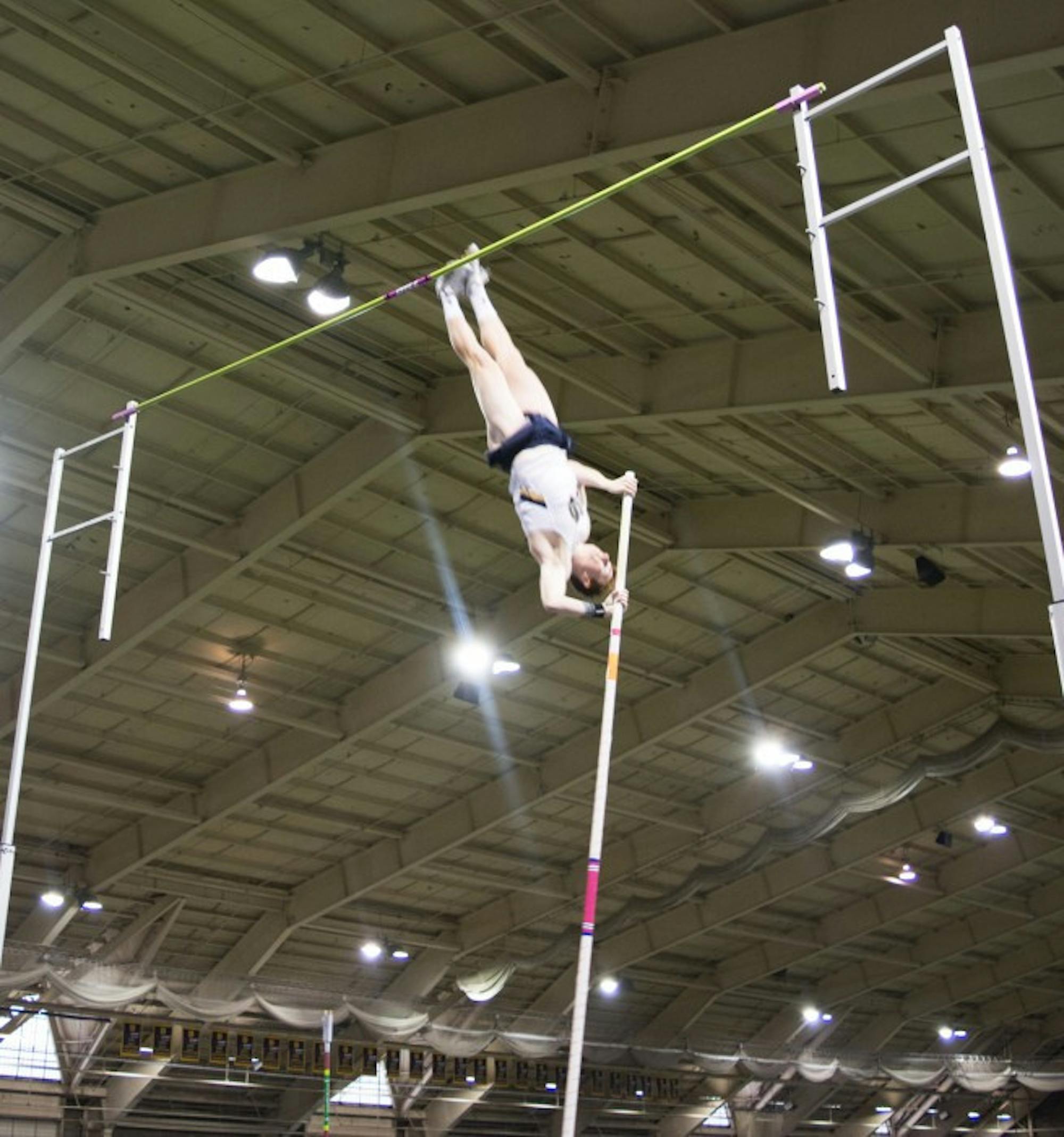 Junior Nate Richartz competes in the pole vault, which he won, at the Meyo Invitational at Loftus Sports Center on Feb. 6.