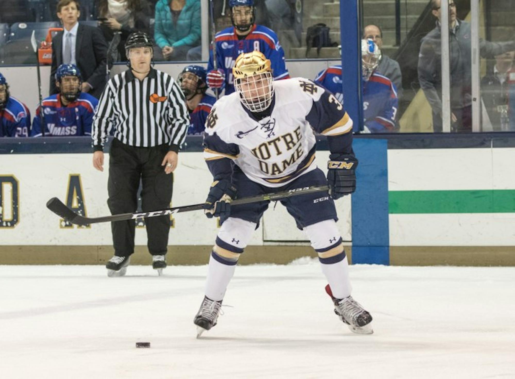 Irish junior defender Jordan Gross looks to pass the puck during Notre Dame’s 4-1 loss to UMass Lowell on Nov. 17 at Compton Family Ice Arena. Gross picked up an assist on Notre Dame’s lone goal in the game.