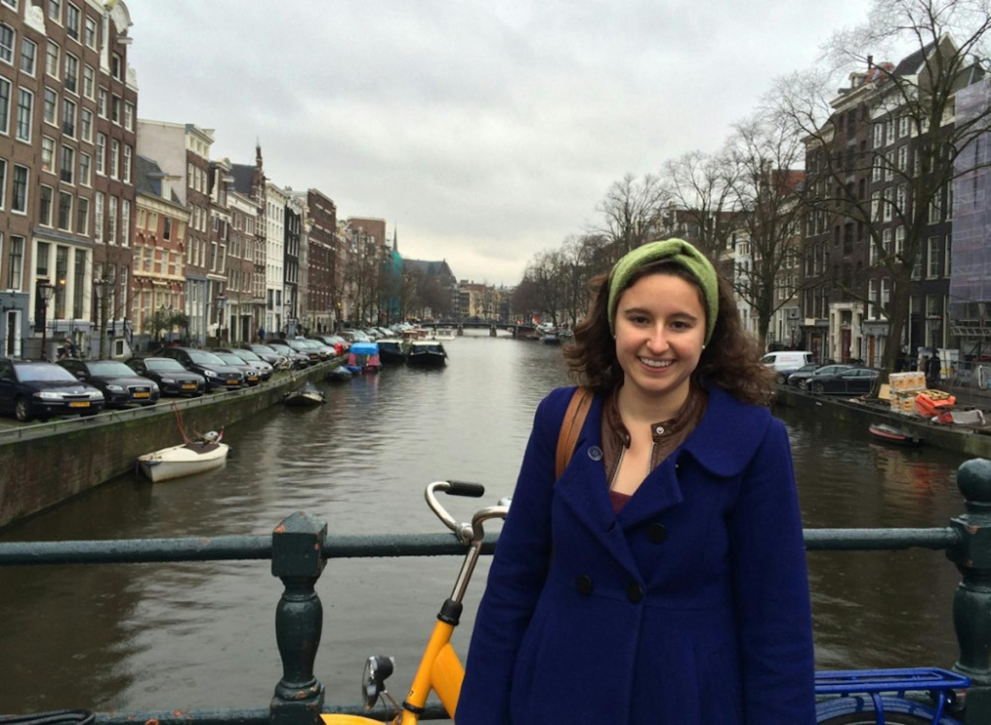 Senior Emmie Mediate stands on a bridge over the Singel canal, located near the Anne Frank House in Amsterdam. Mediate visited the Netherlands and Sweden during her winter break research trip.