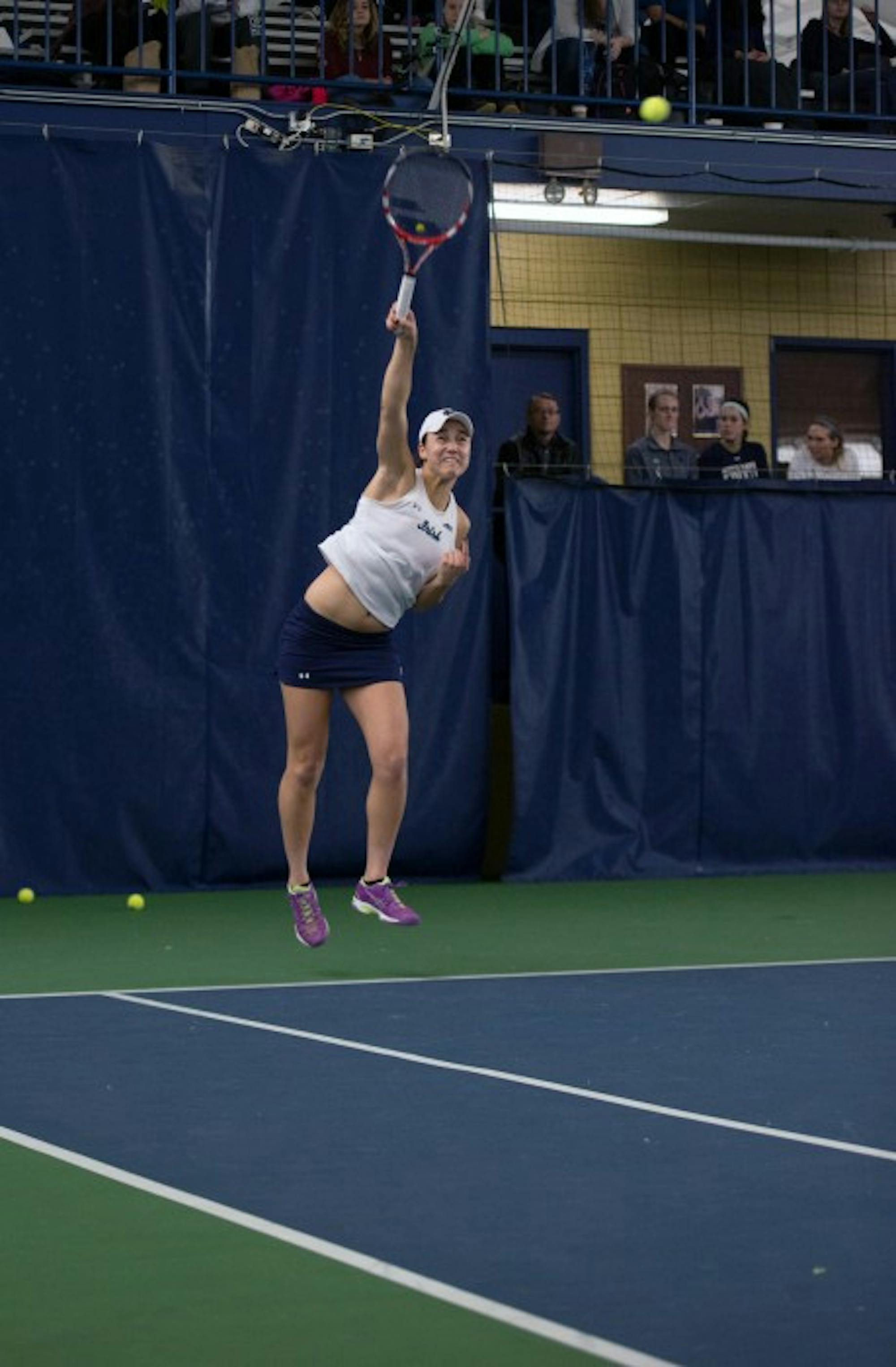 Irish senior Quinn Gleason fires a serve during Notre Dame’s 6-1 loss against Stanford on Feb. 6 at Eck Tennis Pavilion.