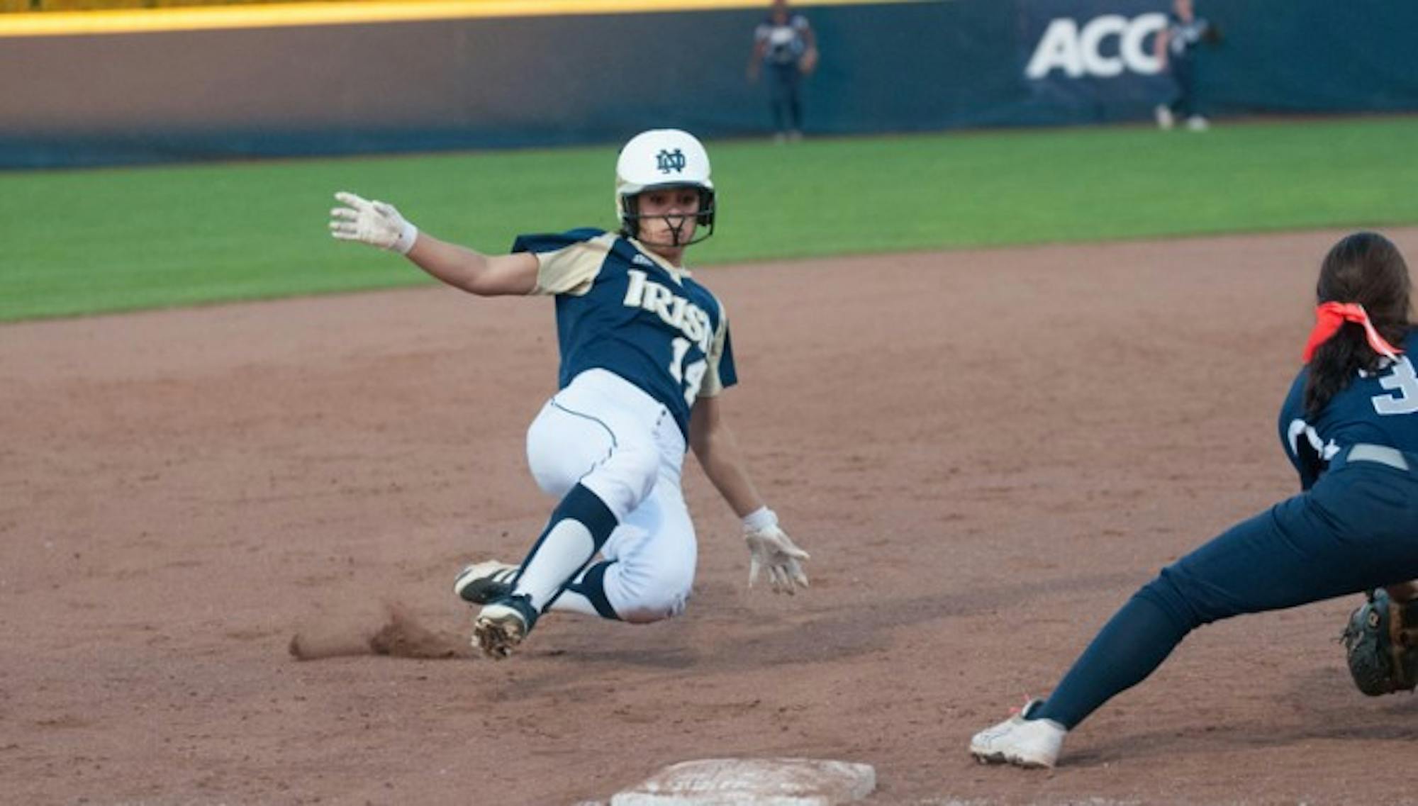 Senior outfielder Monica Torres slides into third base before the tag during a game on Oct. 9. Torres scored a run during Notre Dame's 9-5 win over Virginia Tech on Sunday.