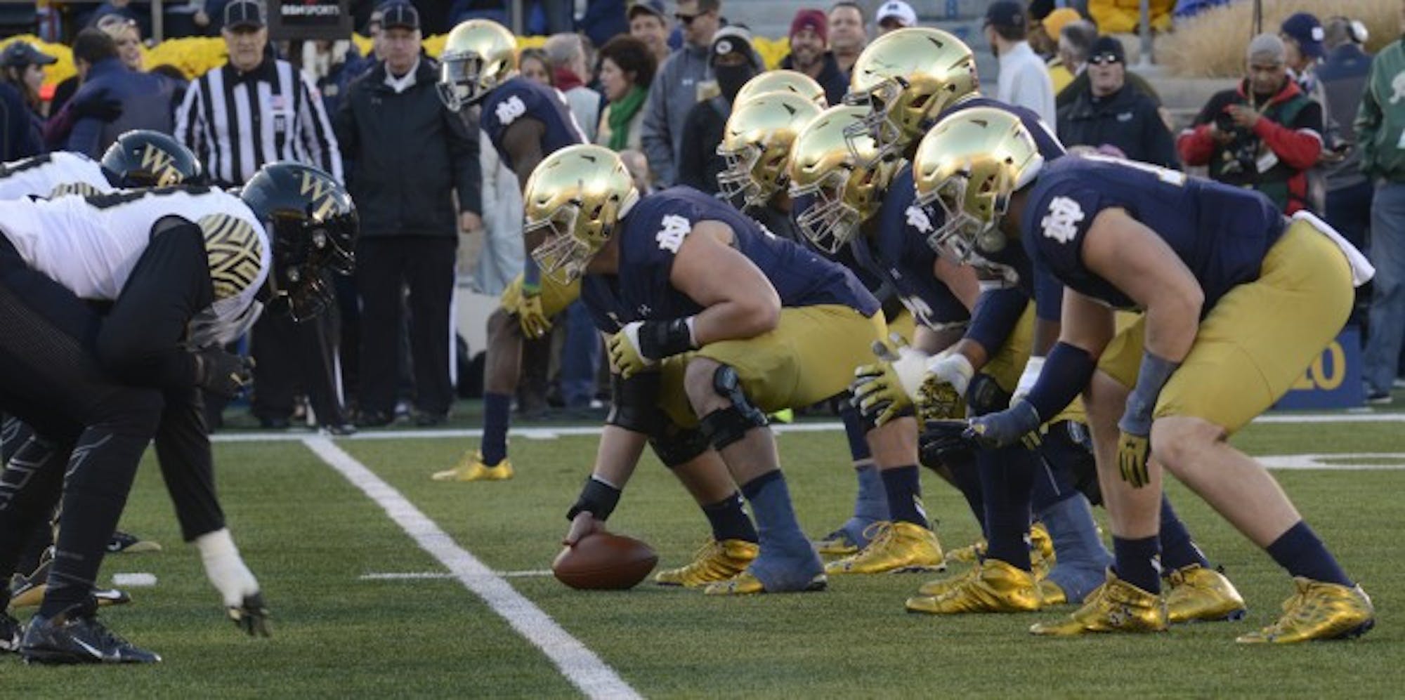 Graduate student center Nick Martin prepares to snap the ball during Notre Dame’s 28-7 win over Wake Forest on Saturday. Martin, a two-time captain, has helped lead the Irish to a 9-1 record this year.