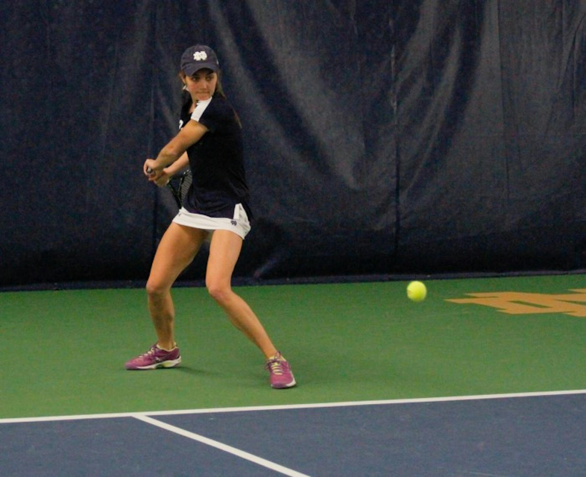 Irish junior Mary Closs positions herself for a backhand during Notre Dame’s 7-0 win over Western Michigan on Jan. 19 at Eck Tennis Pavilion. Closs is 8-7 in singles play this season, as well as 2-2 in doubles play with her primary doubles partner, senior Julie Vrabel.