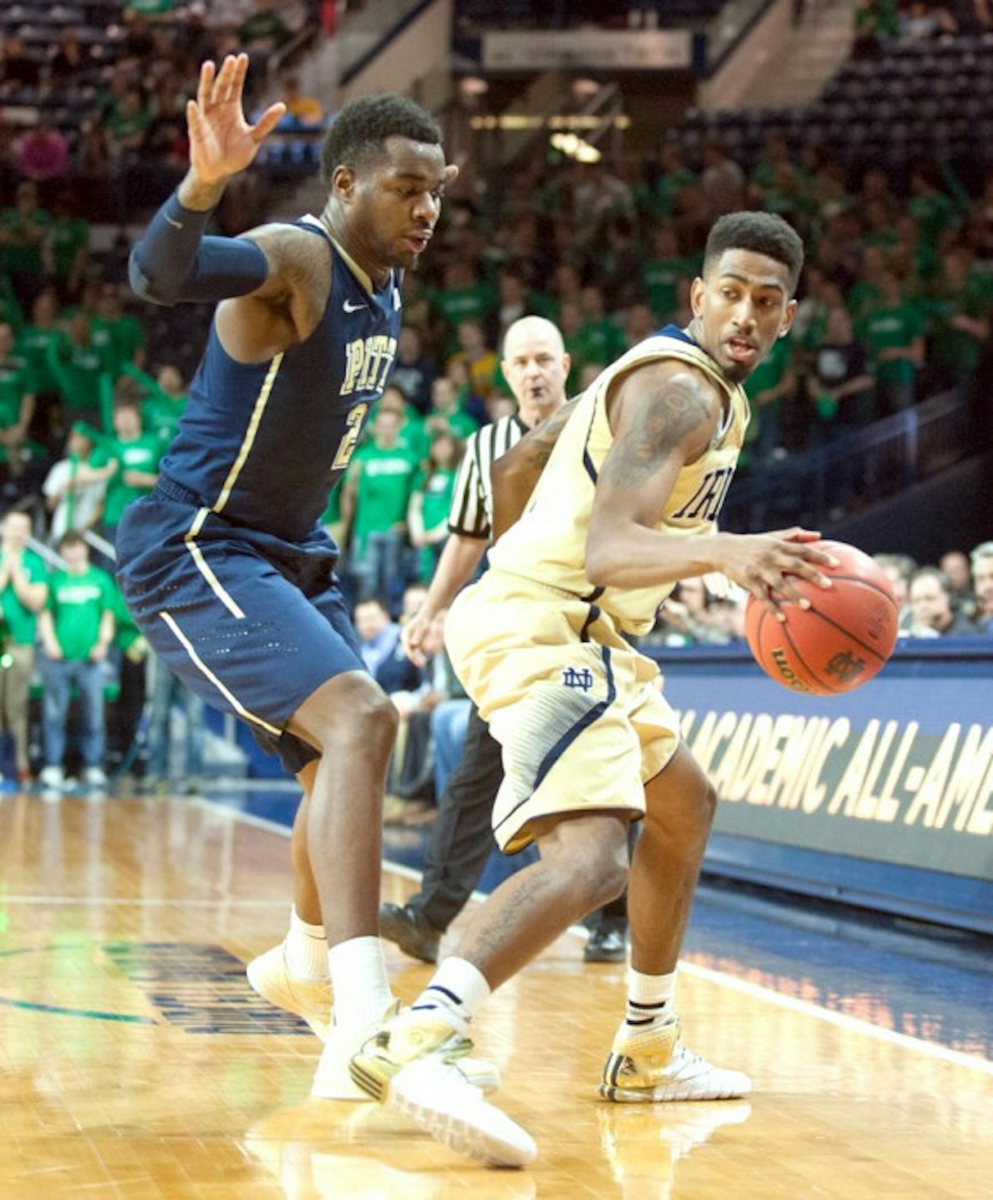 Irish senior guard Eric Atkins controls the ball during Notre Dame's 85-81 overtime loss to Pittsburgh on Saturday in Purcell Pavilion.