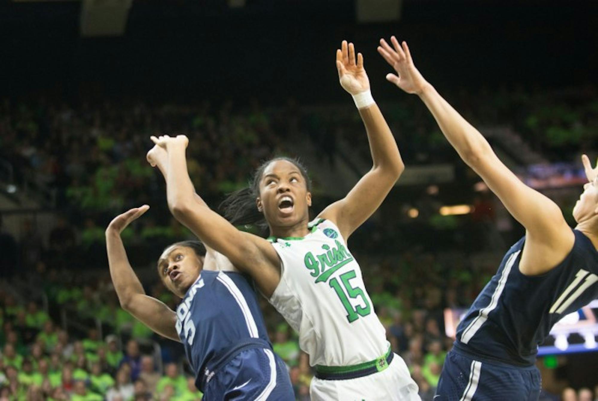 Irish senior guard Lindsay Allen fights through contact to go up for a layup during Notre Dame’s 72-61 loss to UConn on Dec. 7 at Purcell Pavilion.