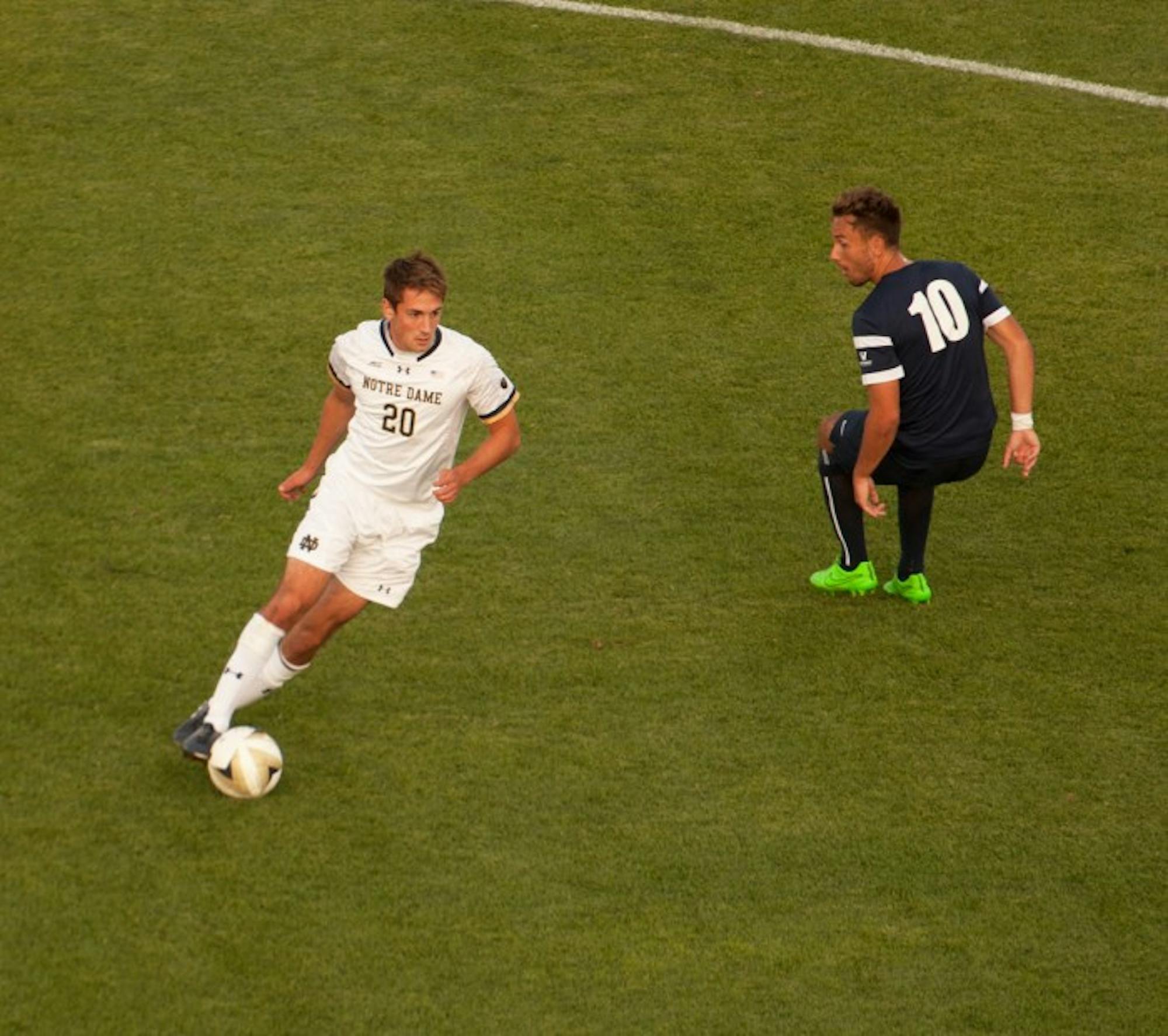 Irish senior midfielder Blake Towns dribbles around a defender during Notre Dame's 2-0 win over San Diego on Aug. 25 at Alumni Stadium.
