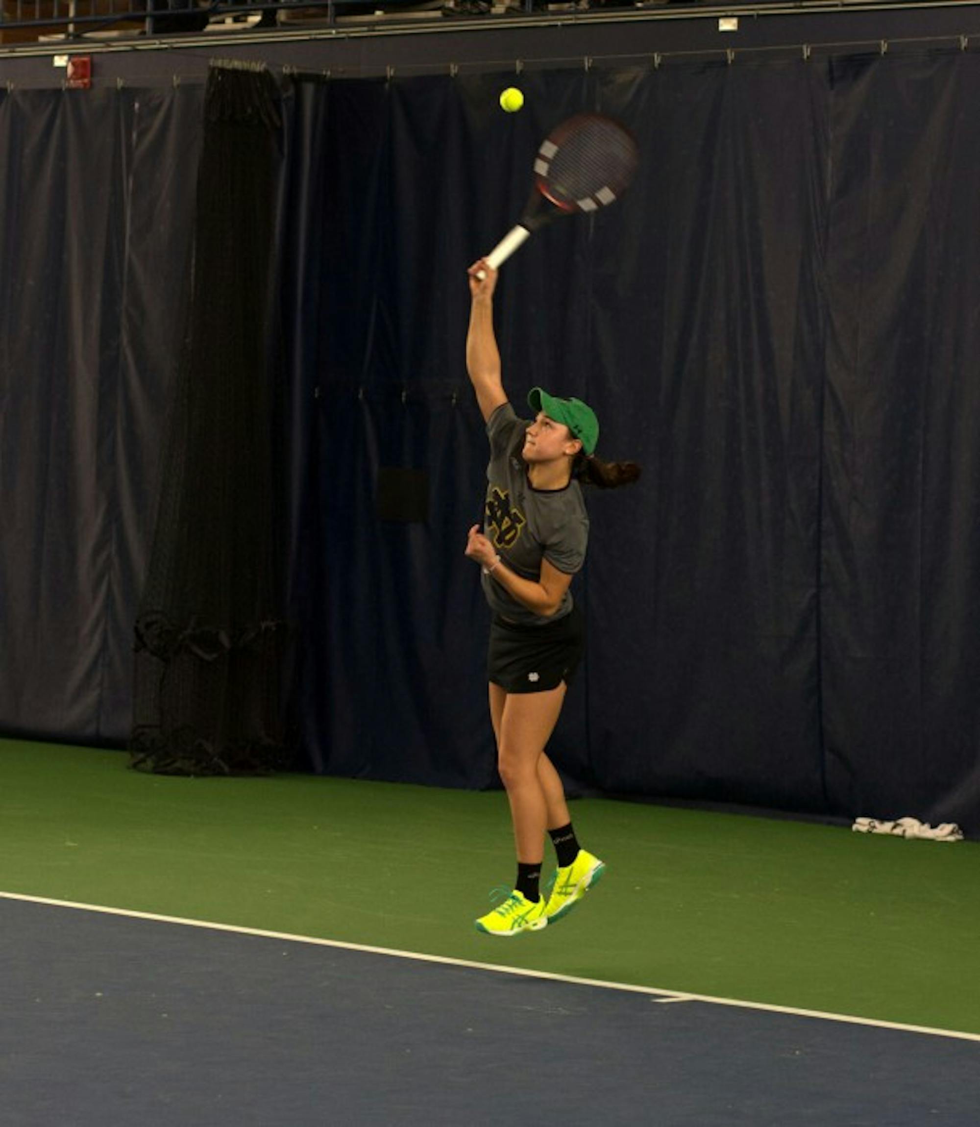 Irish senior Quinn Gleason fires a serve during Notre Dame’s 6-1 win over Indiana on Saturday at Eck Tennis Pavilion. Gleason is 13-3 in singles play this season and 8-5 in doubles play.