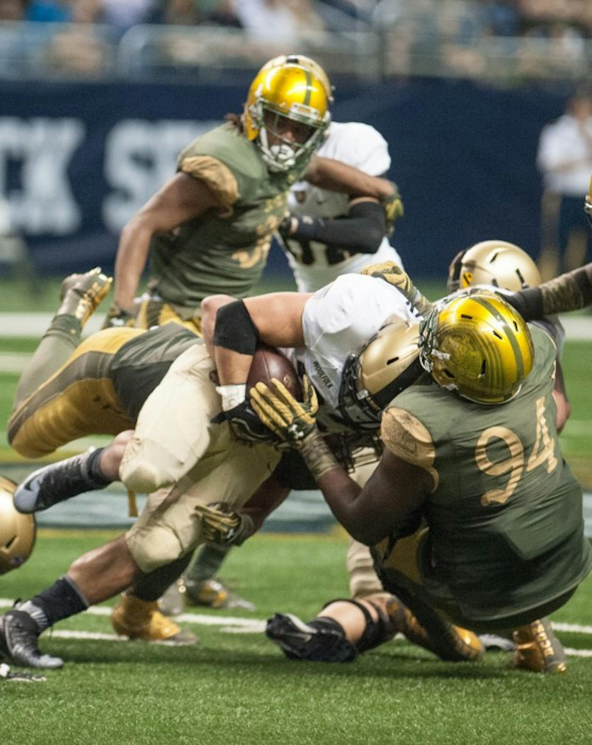 Irish graduate student defensive lineman Jarron Jones makes a tackle during Notre Dame’s 44-6 victory over Army in San Antonio on Nov. 12.