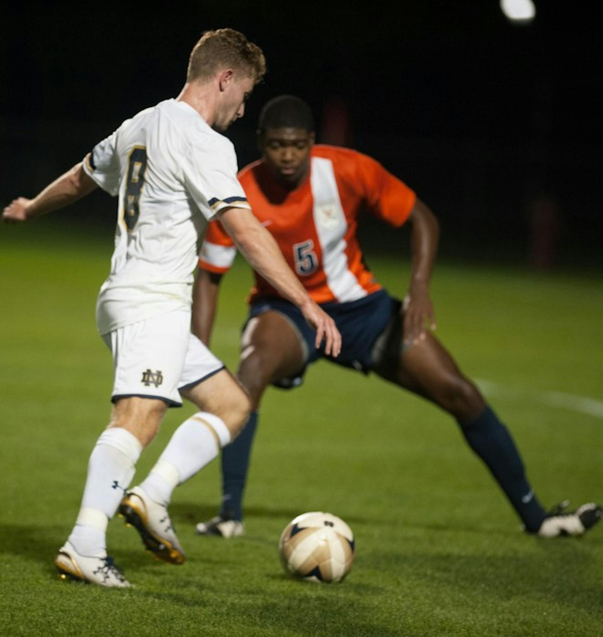 Sophomore  forward Jon Gallagher dribbles into a defender during a 3-1 victory over Virginia on Sept. 25 at Alumni Stadium.